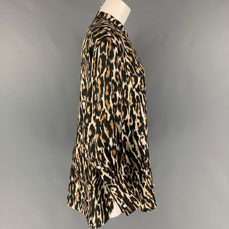 CALVIN KLEIN 205W39NYC shirt comes in a black & brown animal print silk featuring a nehru collar, oversized fit, and a buttoned closure. Made in Italy. 

Very Good Pre-Owned Condition.
Marked: US 2 / IT 38 / FR 34
Original Retail Price: