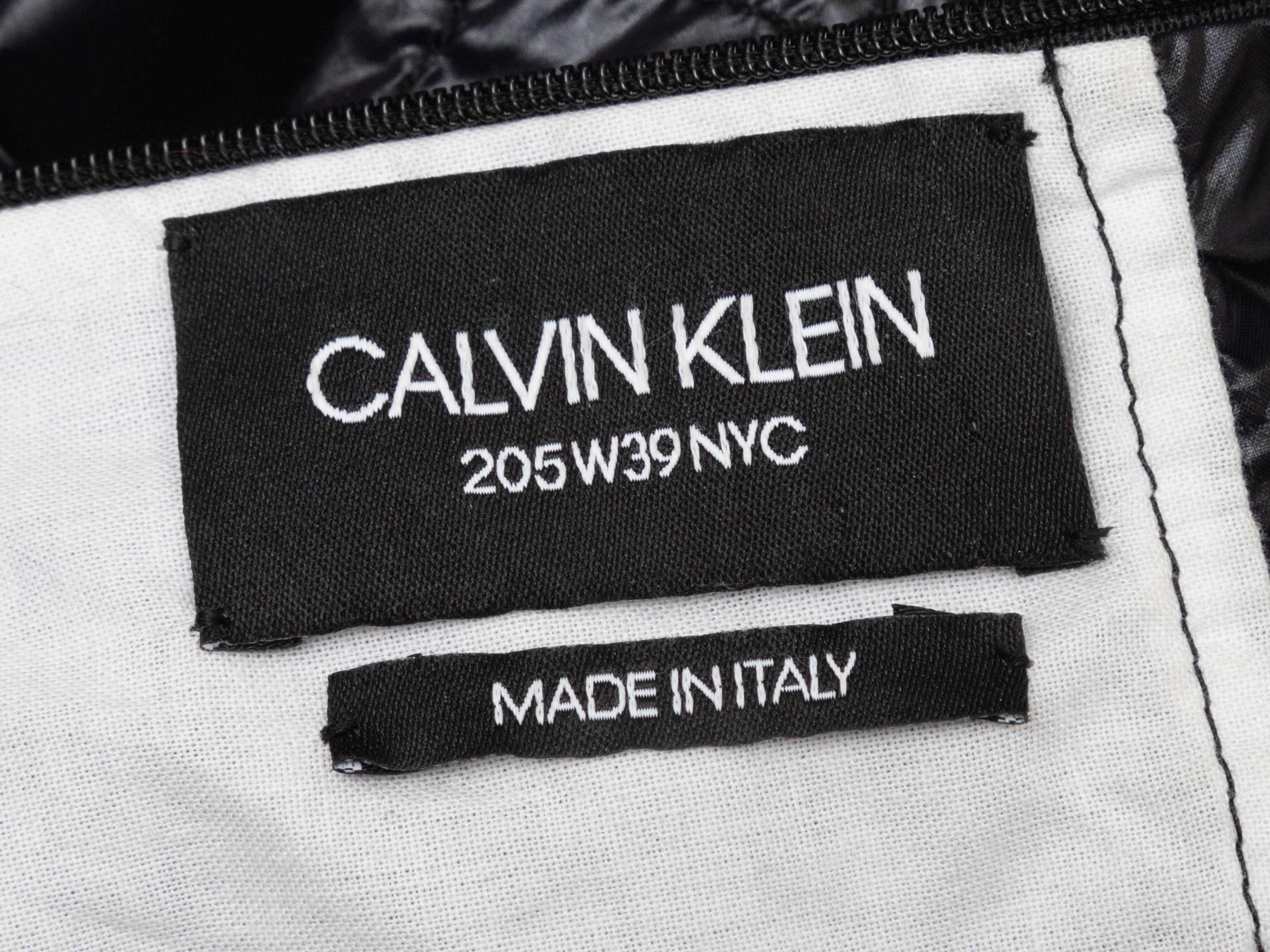 Product Details: Black nylon sleeveless mock neck top by Calvin Klein 205W39NYC. Drawstring tie closure at neck. 36