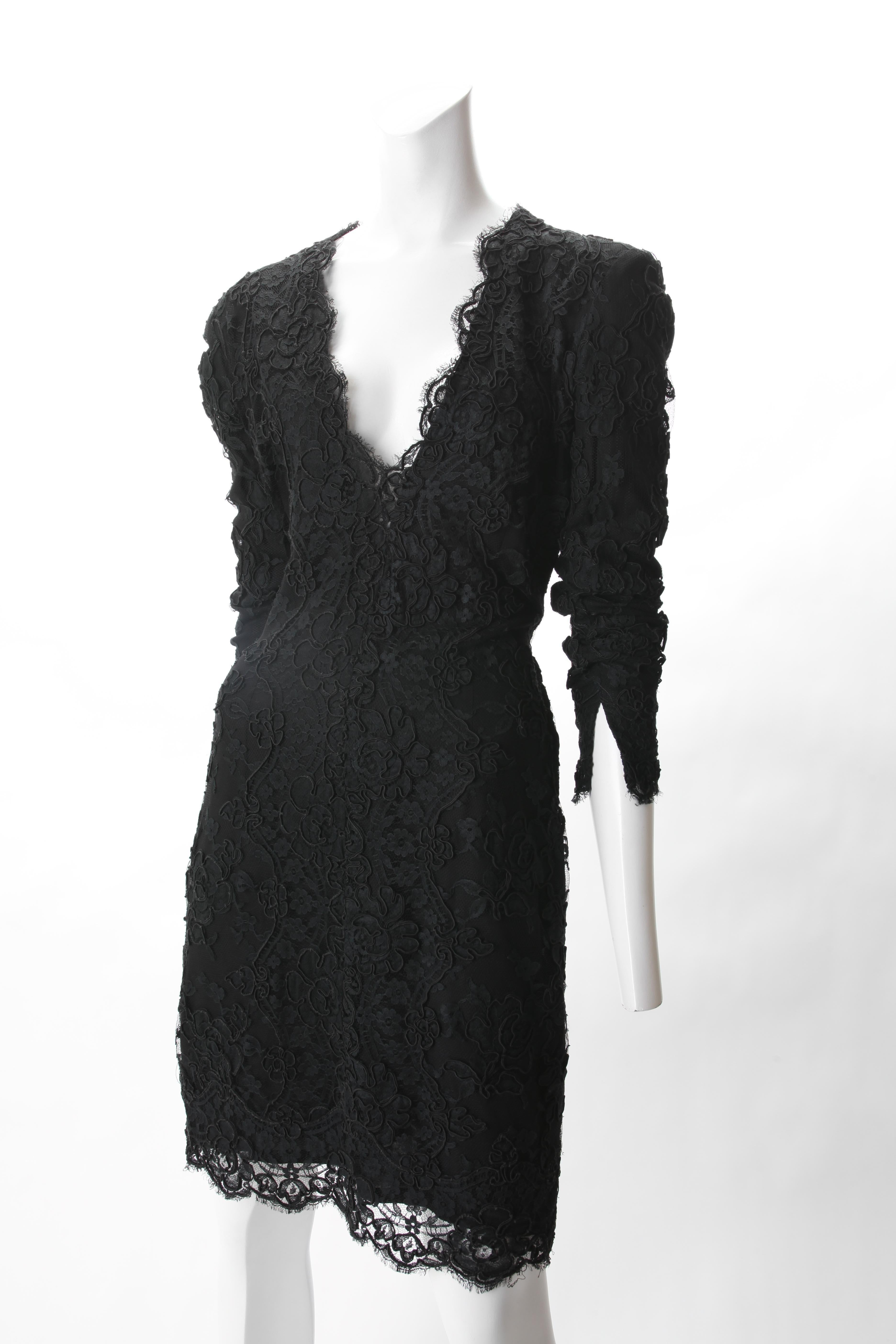 Calvin Klein Black Lace Cocktail Dress, c. 1990s.
Calvin Klein Black Lace Cocktail Dress featuring low cut V-ncekline and shoulder pads. Beautiful Lace hem extends past chiffon lining. Hidden zipper at left side. 

Fits US Size 0 to 2 