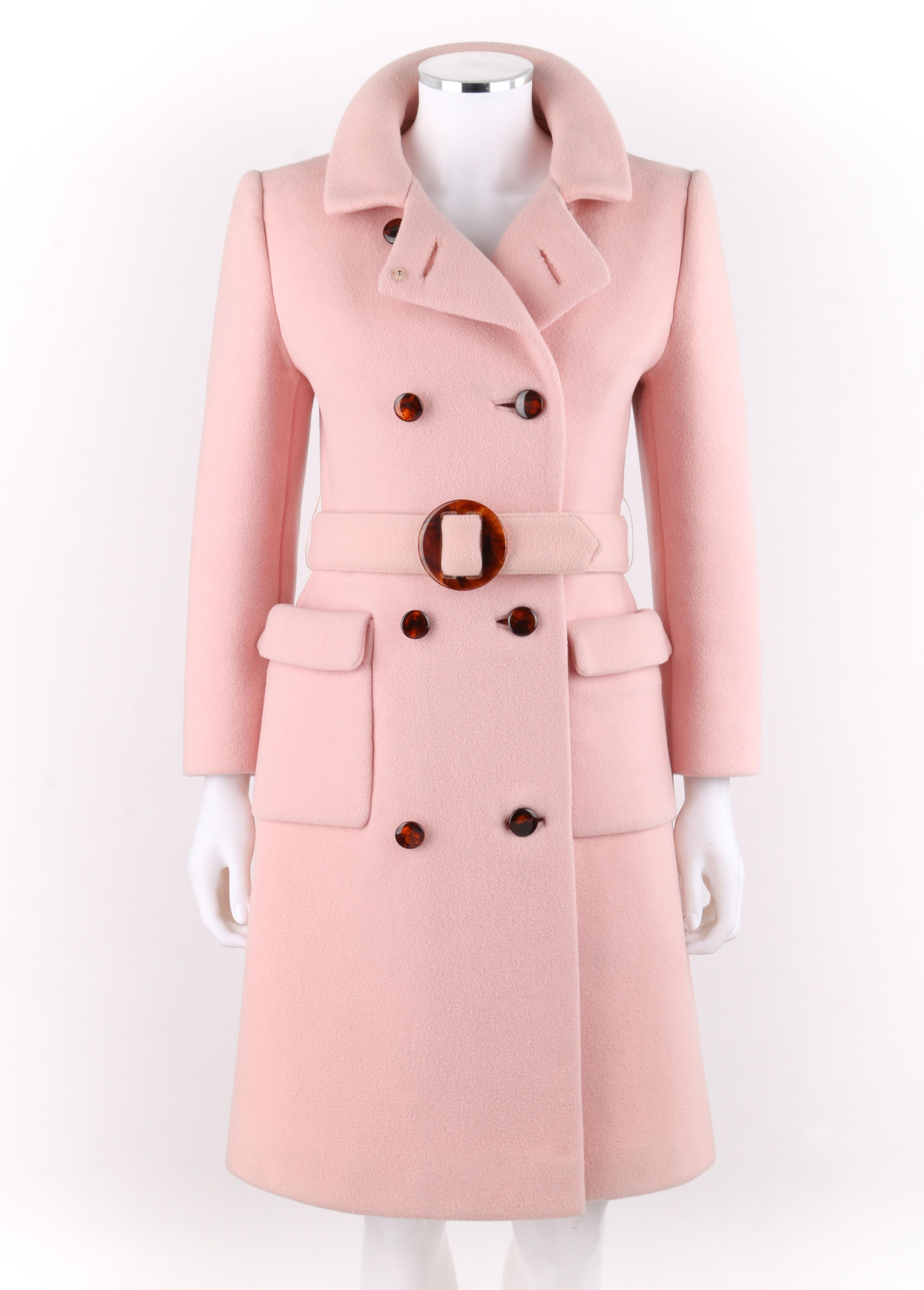 CALVIN KLEIN c.1960’s Mod Soft Pink Wool Tortoise Shell Belted Top Coat (Early Work)
 
Circa: Late 1960’s
Label(s): Calvin Klein / Boston Store / Milwaukee Wisconsin / ILGWU   
Style: Top Coat
Color(s): Pink
Lined: Yes
Unmarked Fabric Content:
