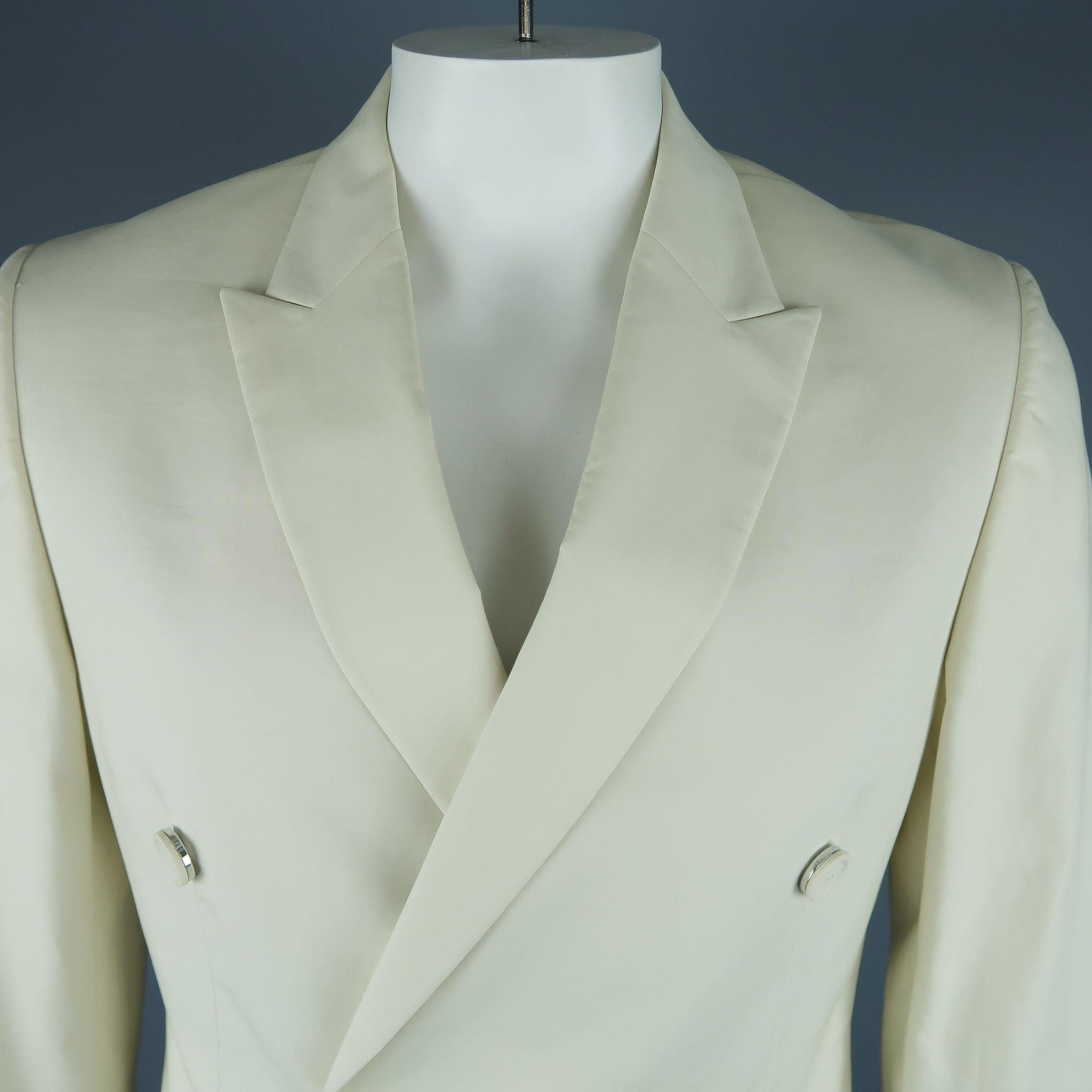 CALVIN KLEIN COLLECTION sport coat comes in a bone white with a full liner featuring a peak lapel, flap pockets, and a double breasted closure. Made in Italy.New With Tags.
 

Marked:   52/42 

Measurements: 
 
Shoulder: 18 inches 
Chest: 42 inches