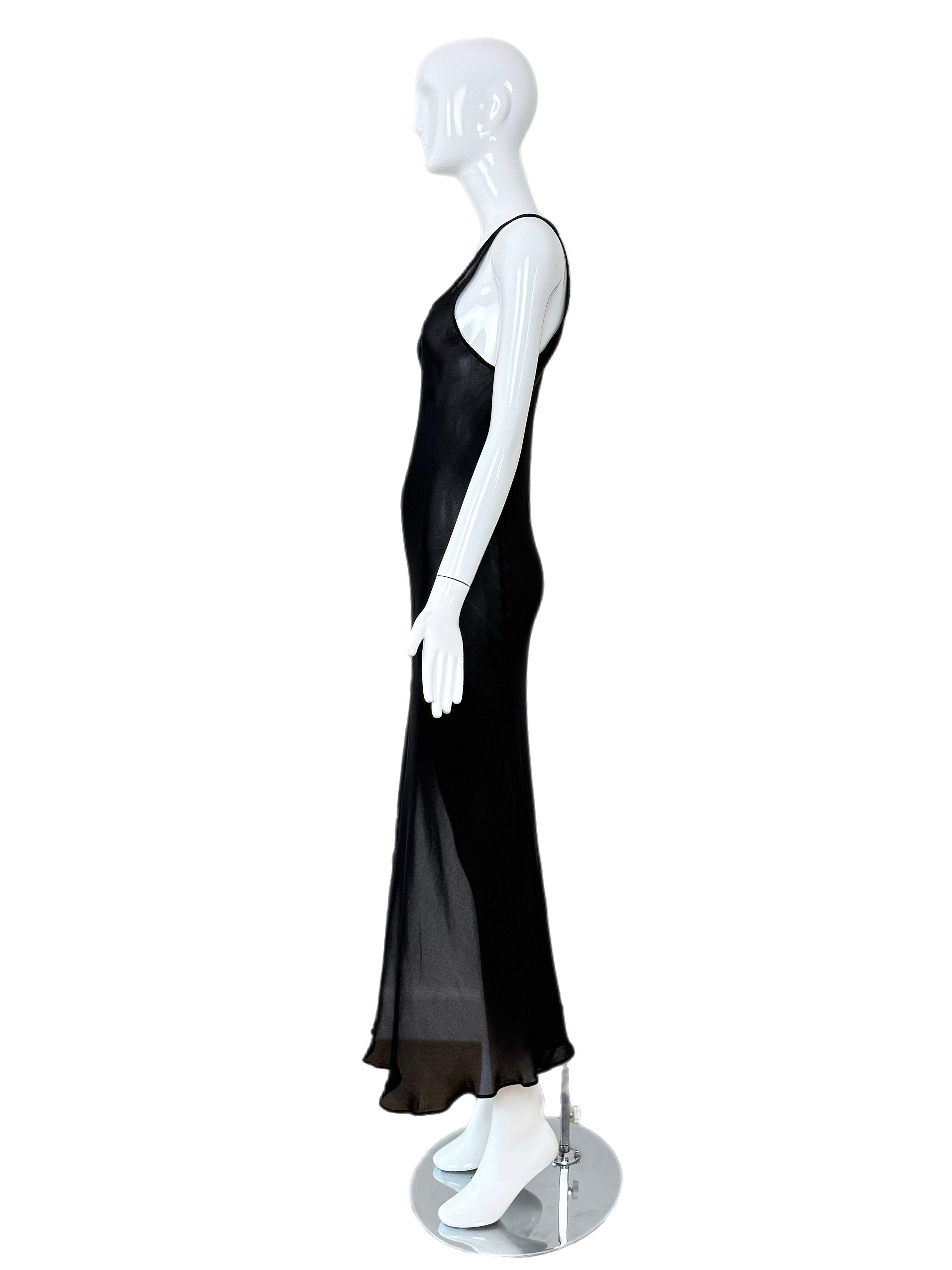 Calvin Klein Collection
1990's
Vintage
Jet black
100% silk
Sheer
Front side slit
Pullover
Size USA 6
Excellent condition, minor feeling of wear
Measurements in inches laying flat: length 57, pit to pit 14.5 to 16, smallest of waist 13 to 15

Final