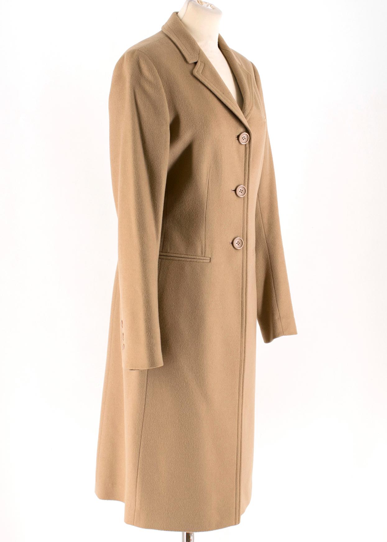 Calvin Klein Camel Wool & Cashmere Blend Coat 

- Wool and cashmere blend coat
- Long sleeves
- Standard notch collar
- Front centre snap button closure
- Mid-weight
- Non functional pockets

Please note, these items are pre-owned and may show signs