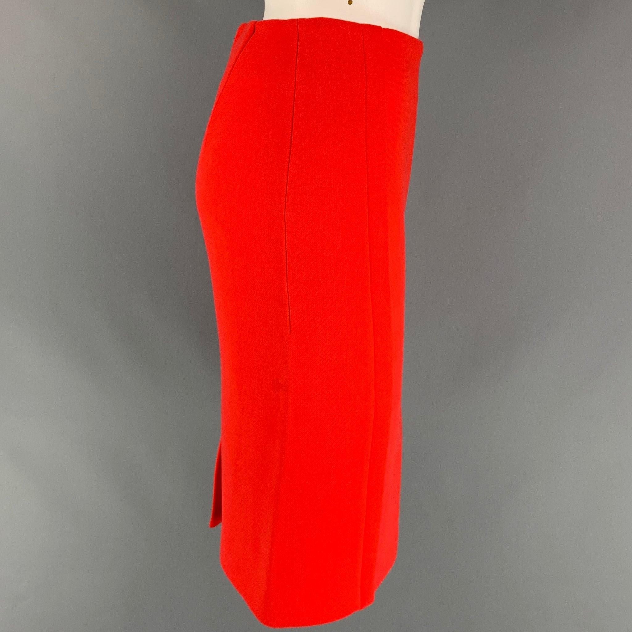 CALVIN KLEIN COLLECTION skirt comes in a orange wool with a full liner featuring a pencil style, high waisted, single back vent, and a back zip up closure. Made in Italy.
Very Good
Pre-Owned Condition. 

Marked:   0/36 

Measurements: 
  Waist: 26