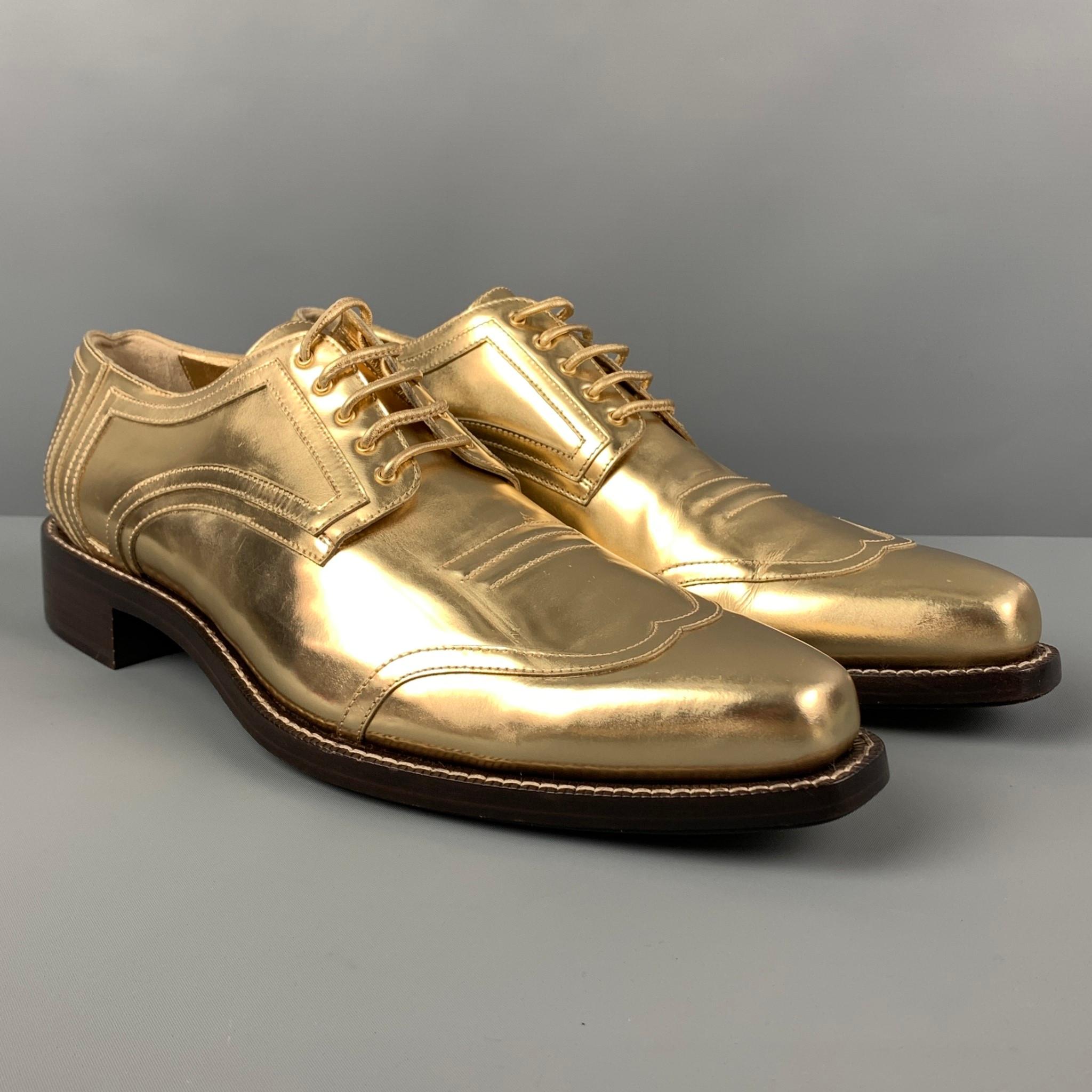 CALVIN KLEIN COLLECTION shoes comes in a gold metallic leather featuring a square toe, top stitching, and a lace up closure. Made in Italy. 

Very Good Pre-Owned Condition.
Marked: 12

Outsole: 13.25 in. x 4.5 in. 