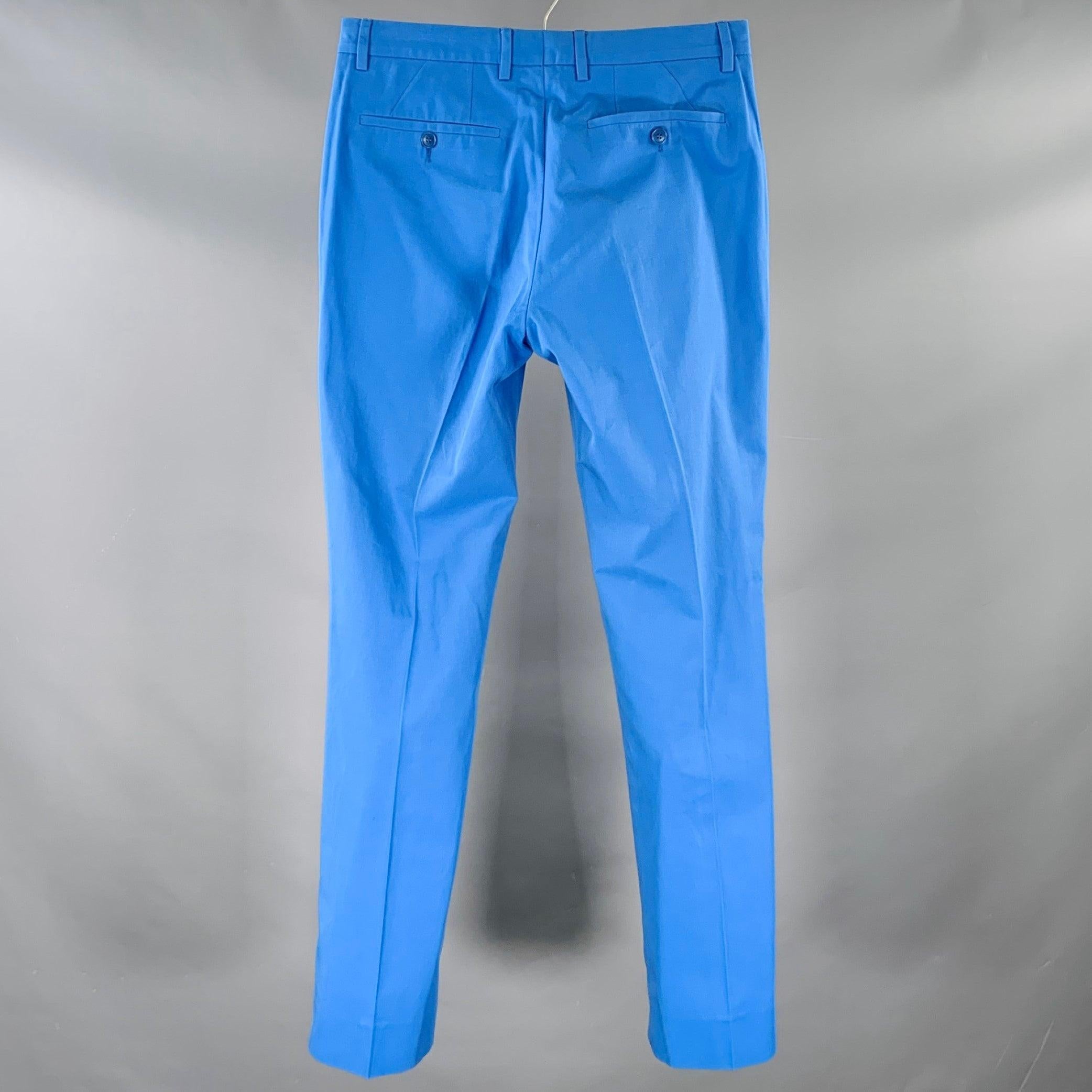 CALVIN KLEIN COLLECTION dress pants
in a blue cotton twill featuring a flat front style, straight leg, and zip fly closure. Very Good Pre-Owned Condition. Minor signs of wear. 

Marked:   46/36 

Measurements: 
  Waist: 31 inches Rise: 9 inches