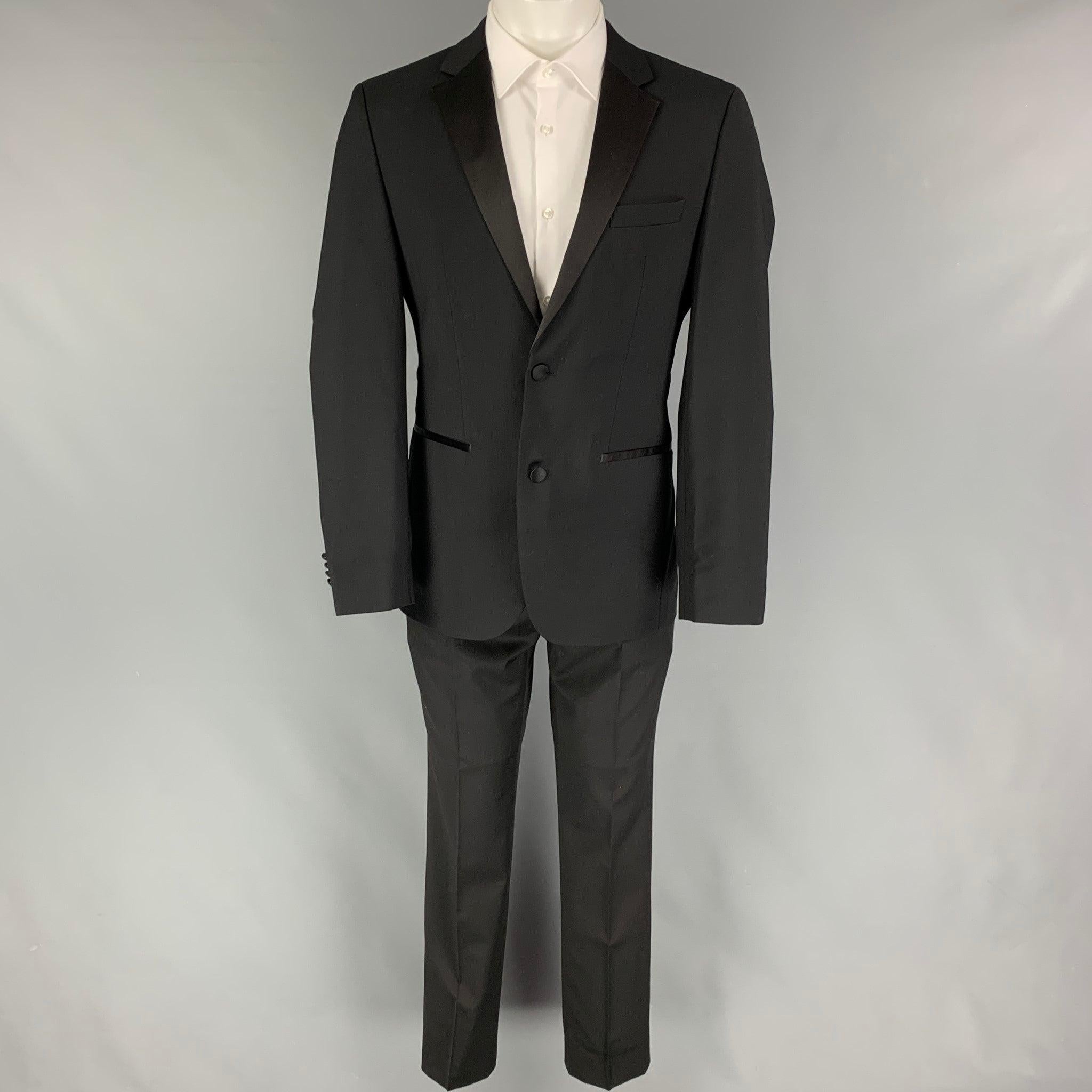 CALVIN KLEIN COLLECTION suit comes in a black wool with a full liner and includes a single breasted, single button sport coat with a notch lapel and matching flat front trousers. Very Good Pre-Owned Condition. 

Marked:   46/36 

Measurements: 
 