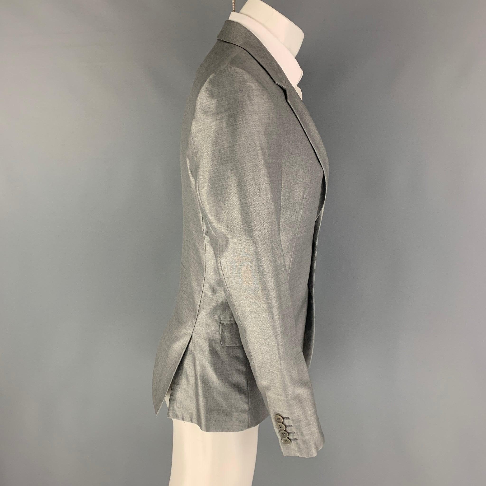 CALVIN KLEIN sport coat comes in a grey rayon with a full liner featuring a notch lapel, flap pockets, double back vent, and a double button closure.
Excellent
Pre-Owned Condition. 

Marked:   46/36 

Measurements: 
 
Shoulder: 17 inches Chest: 36