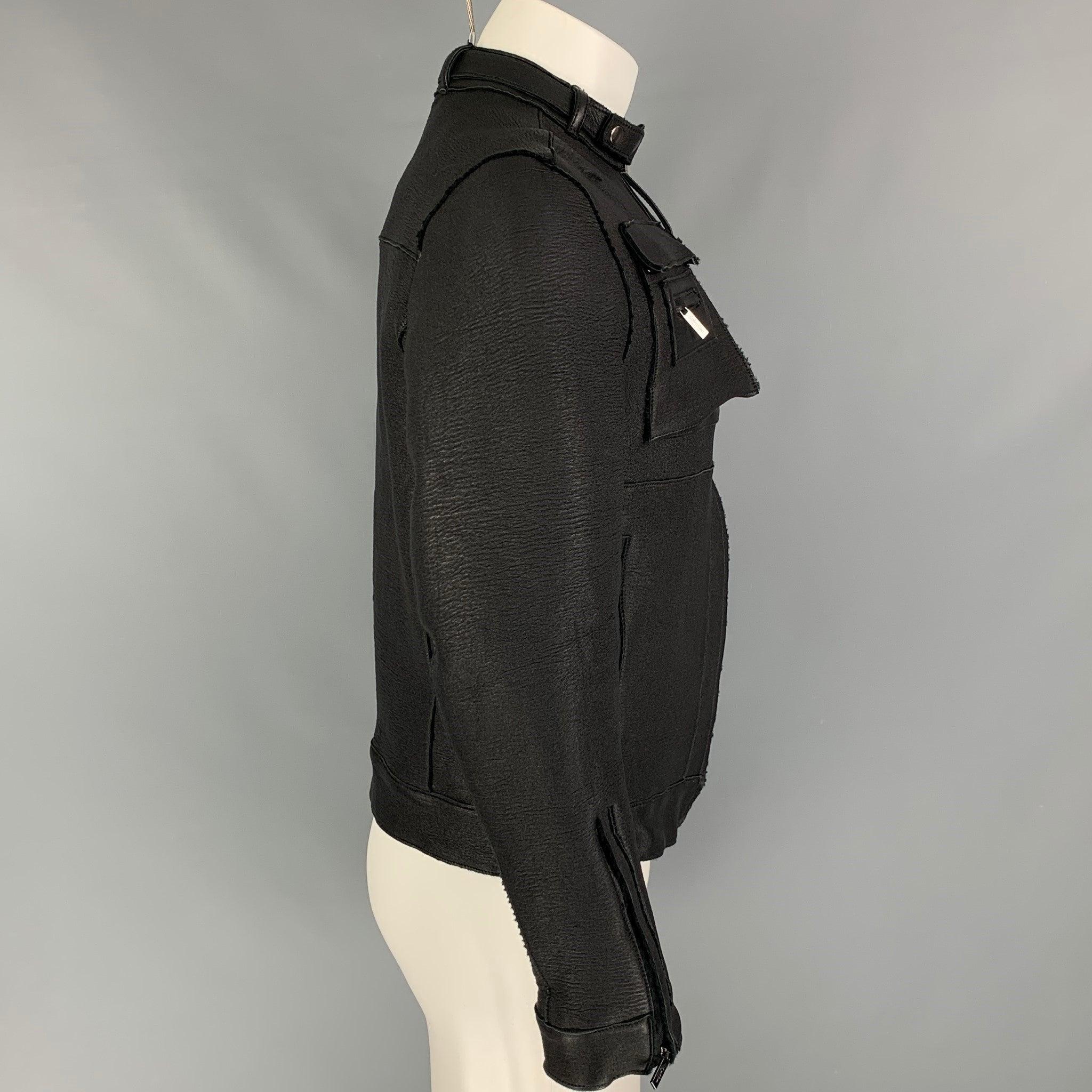 CALVIN KLEIN COLLECTION jacket comes in a black leather with a full liner featuring a motorcycle style, multiple front pockets, removable front collar strap, and a full zip up closure. Made in Italy.
Very Good
Pre-Owned Condition. 

Marked:   48/38