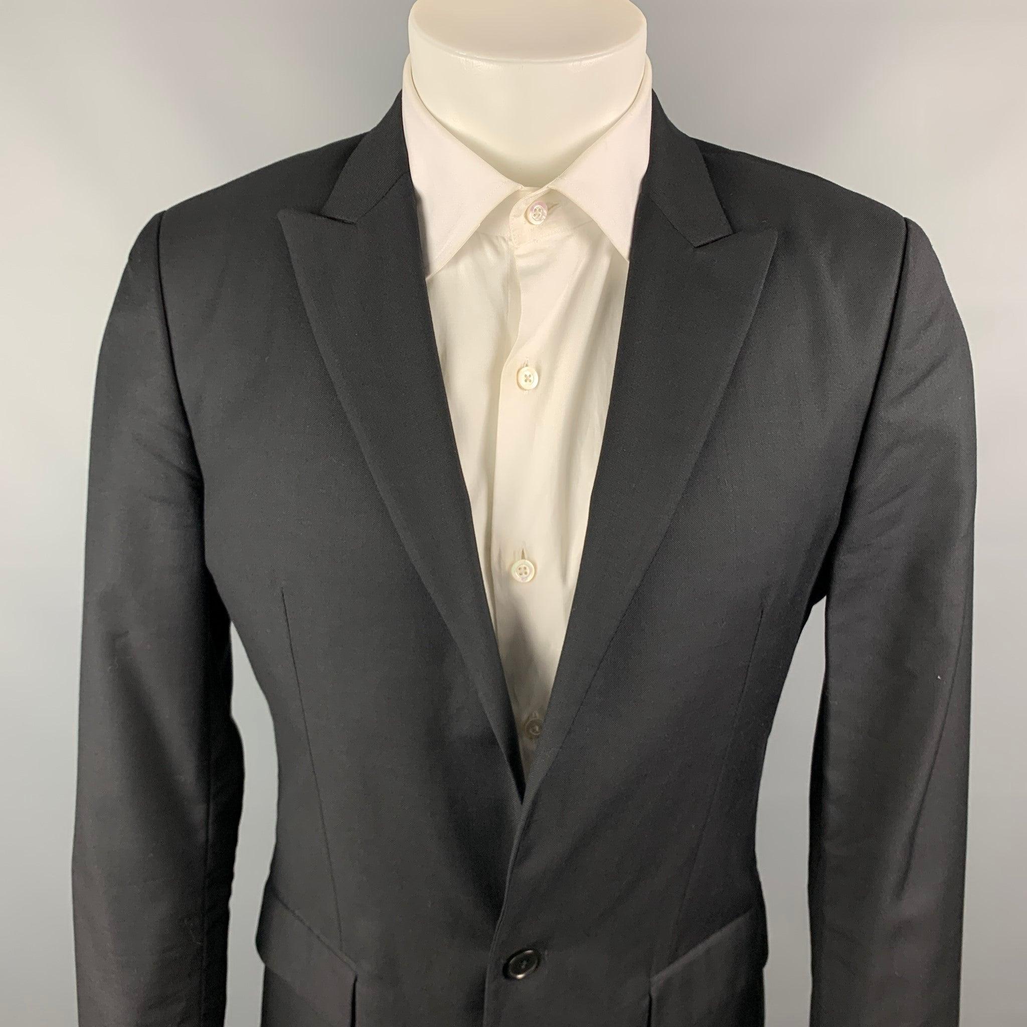 CALVIN KLEIN COLLECTION sport coat comes in a black wool / silk with a full liner featuring a notch lapel, flap pockets, and a double button closure. Very Good Pre-Owned Condition. 

Marked:   46/36 

Measurements: 
 
Shoulder: 17.5 inches  Chest: