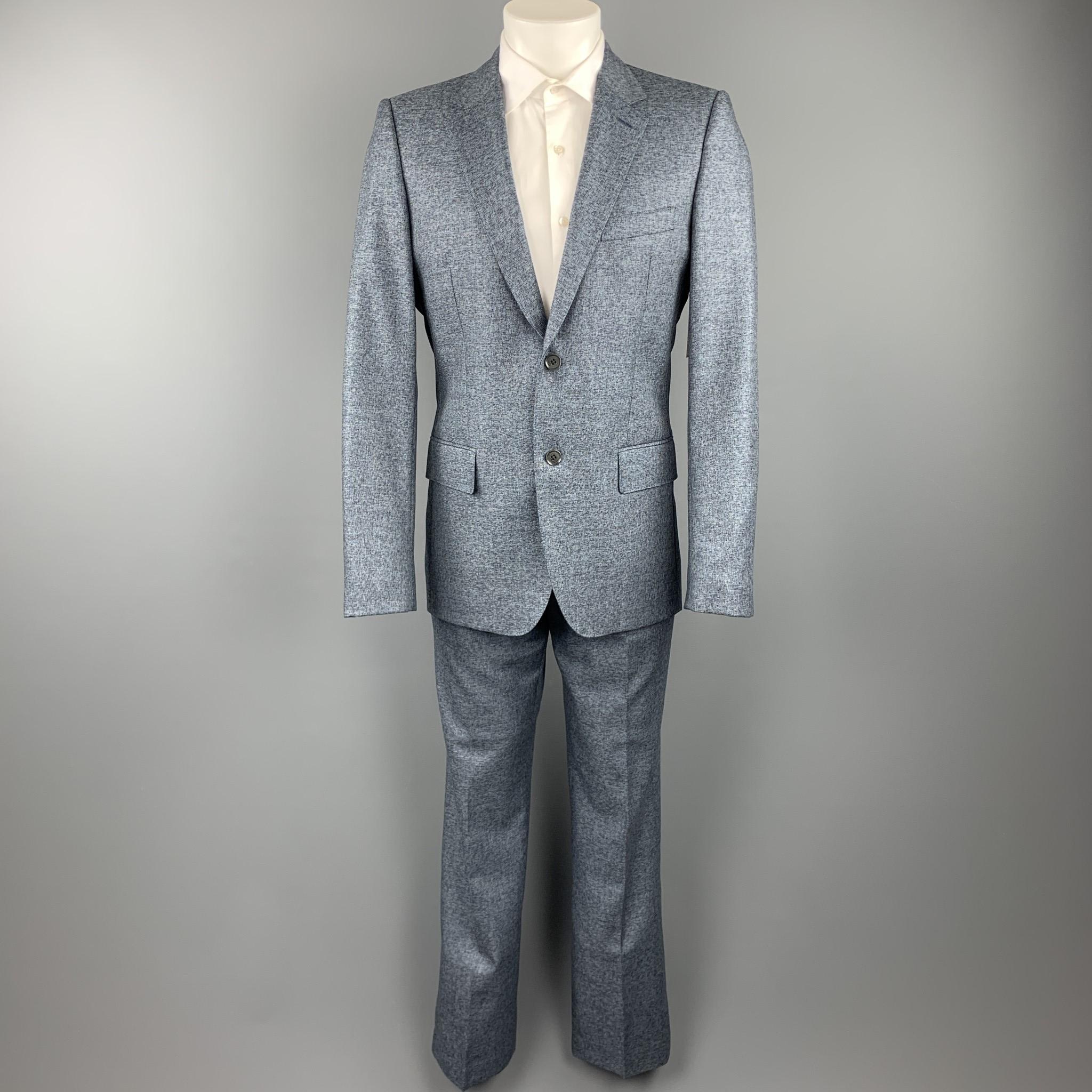 CALVIN KLEIN COLLECTION suit comes in a blue heather wool with a teal liner and includes a single breasted, two button sport coat with a notch lapel and matching flat front trousers. As-Is. Minor wear on the liner. 

Good Pre-Owned