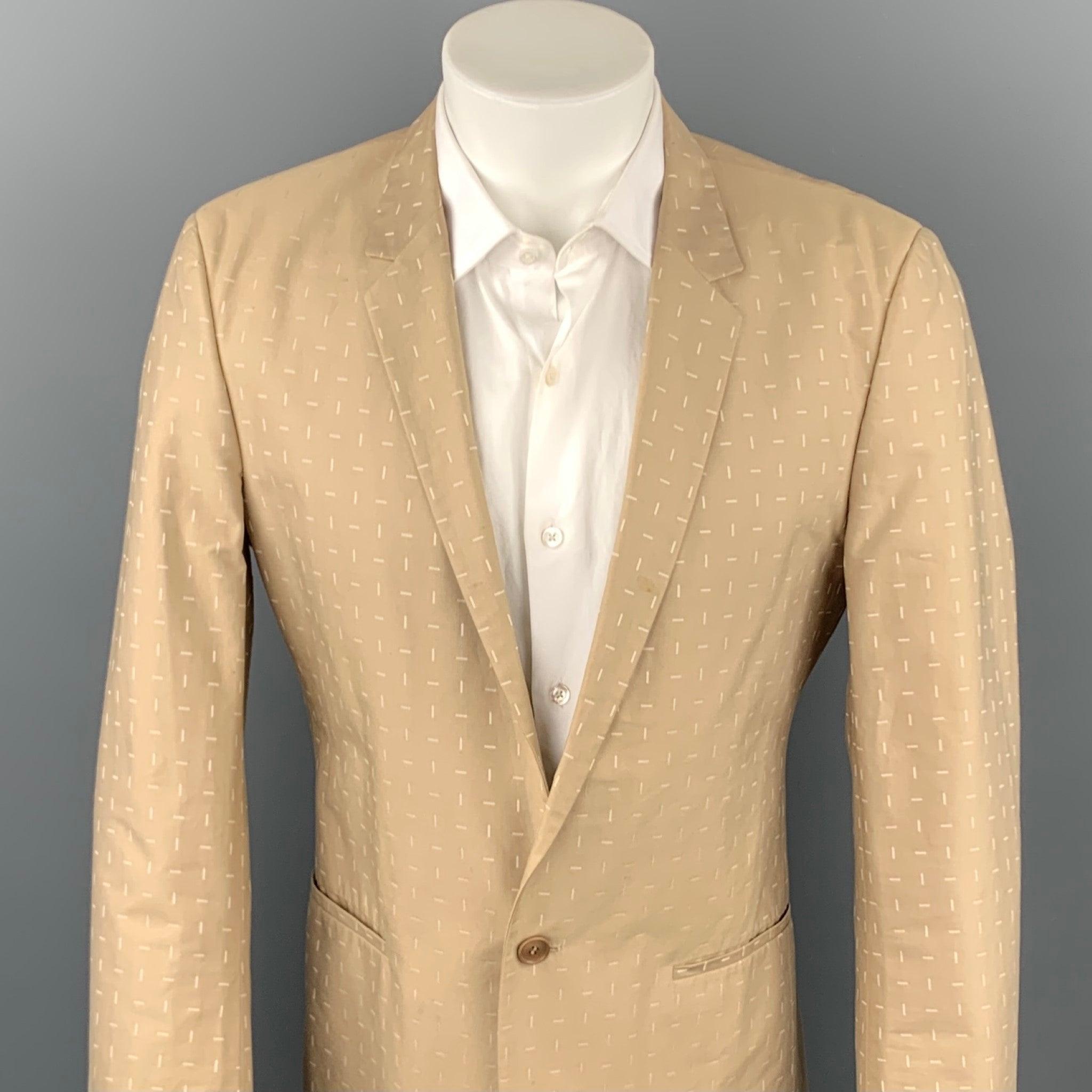 CALVIN KLEIN COLLECTION sport coat comes in a khaki print cotton with a full liner featuring a notch lapel, slit pockets, and a single button closure. Minor wear throughout.Good
Pre-Owned Condition. 

Marked:   48/38 

Measurements: 
 
Shoulder: 18