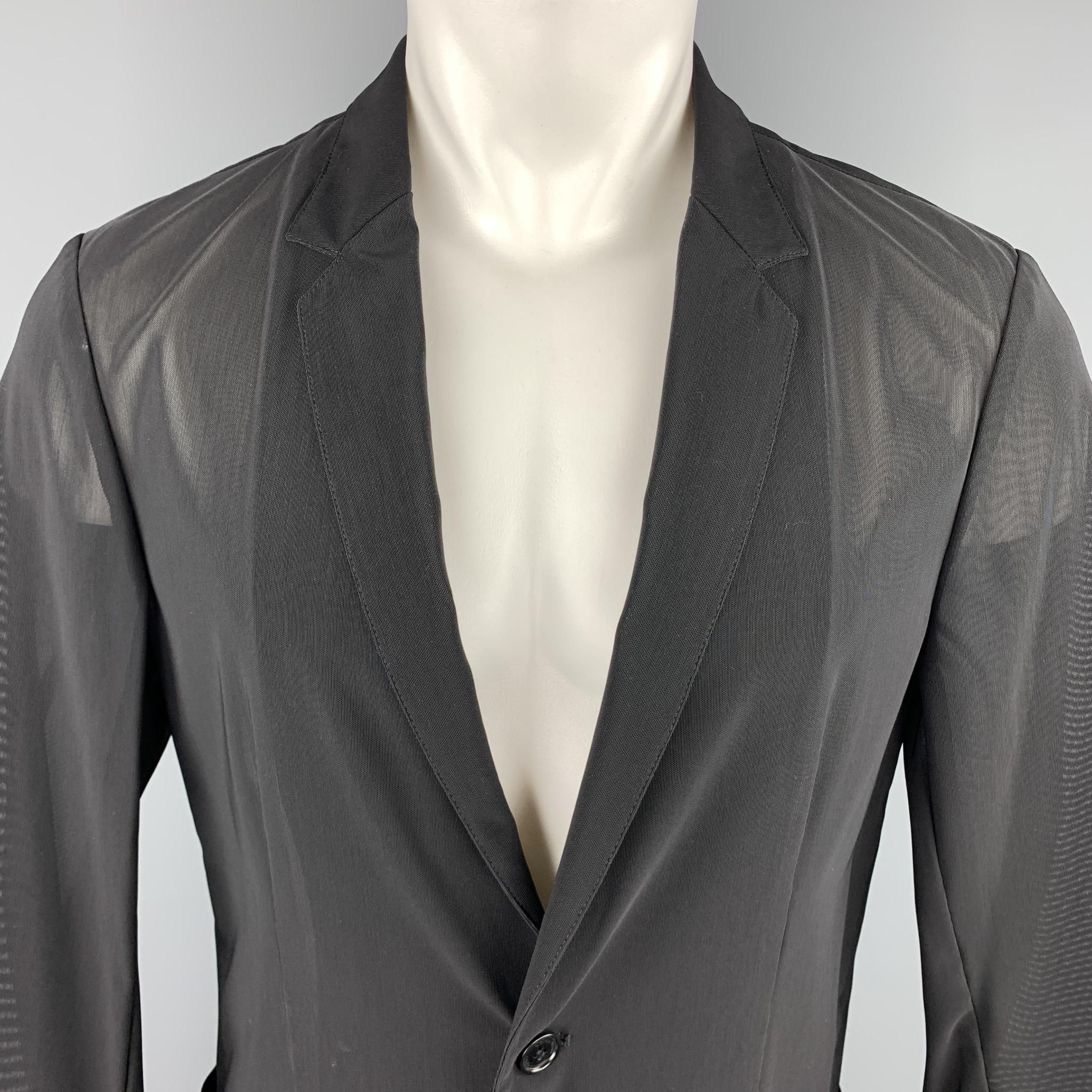 CALVIN KLEIN COLLECTION sport coat comes in sheer stretch mesh with a notch lapel, single breasted, two button front, and pockets. Made in Italy.

Excellent Pre-Owned Condition.
Marked: US 40

Measurements:

Shoulder: 18 in.
Chest: 40 in.
Sleeve: 24