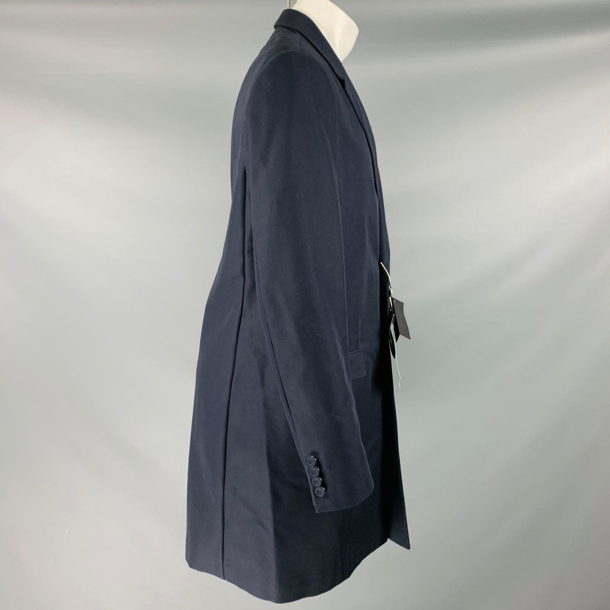 CALVIN KLEIN COLLECTION coat
in a navy cotton blend fabric featuring a notch lapel, two pockets, and double button closure. Made in Italy.New with Tags. 

Marked:   50/40 

Measurements: 
 
Shoulder: 17 inches Chest: 40 inches Sleeve: 27.5 inches