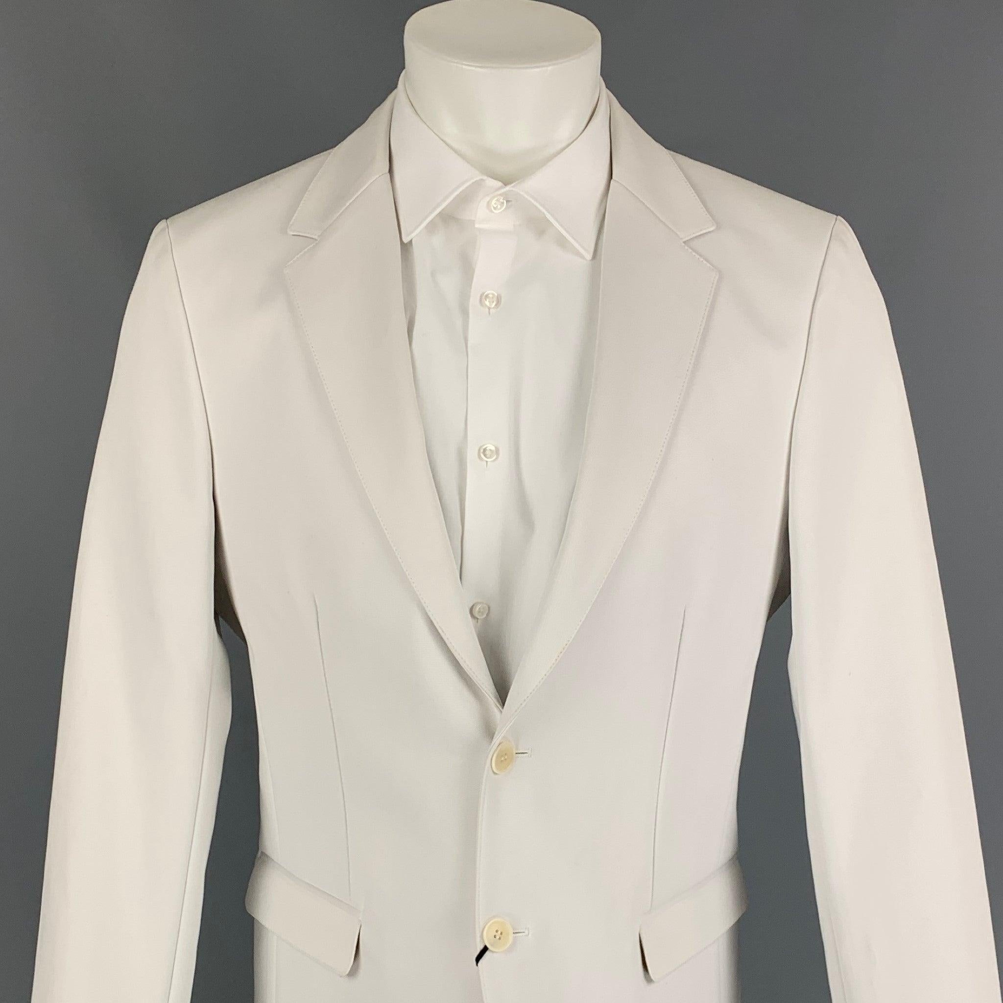 CALVIN KLEIN COLLECTION sport coat comes in a off white cotton featuring a notch lapel, flap pockets, and a double button closure.
New With Tags.
 

Marked:   50/40 

Measurements: 
 
Shoulder: 18 inches  Chest: 40 inches  Sleeve: 26 inches  Length: