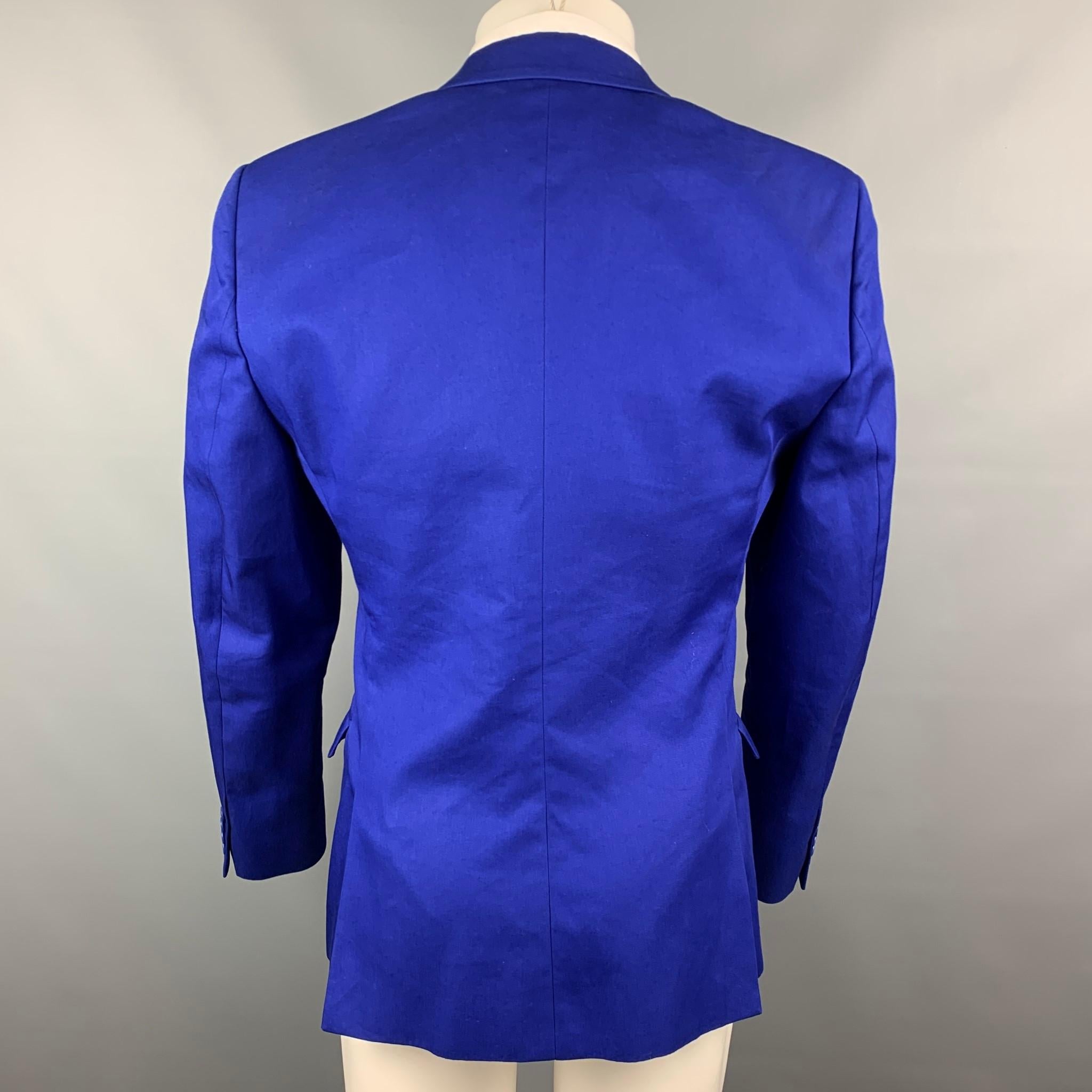 CALVIN KLEIN COLLECTION sport coat comes in a royal blue cotton / polyester with a full liner featuring a notch lapel, flap pockets, and a double button closure.

Very Good Pre-Owned Condition.
Marked: 50/40

Measurements:

Shoulder: 18 in.
Chest: