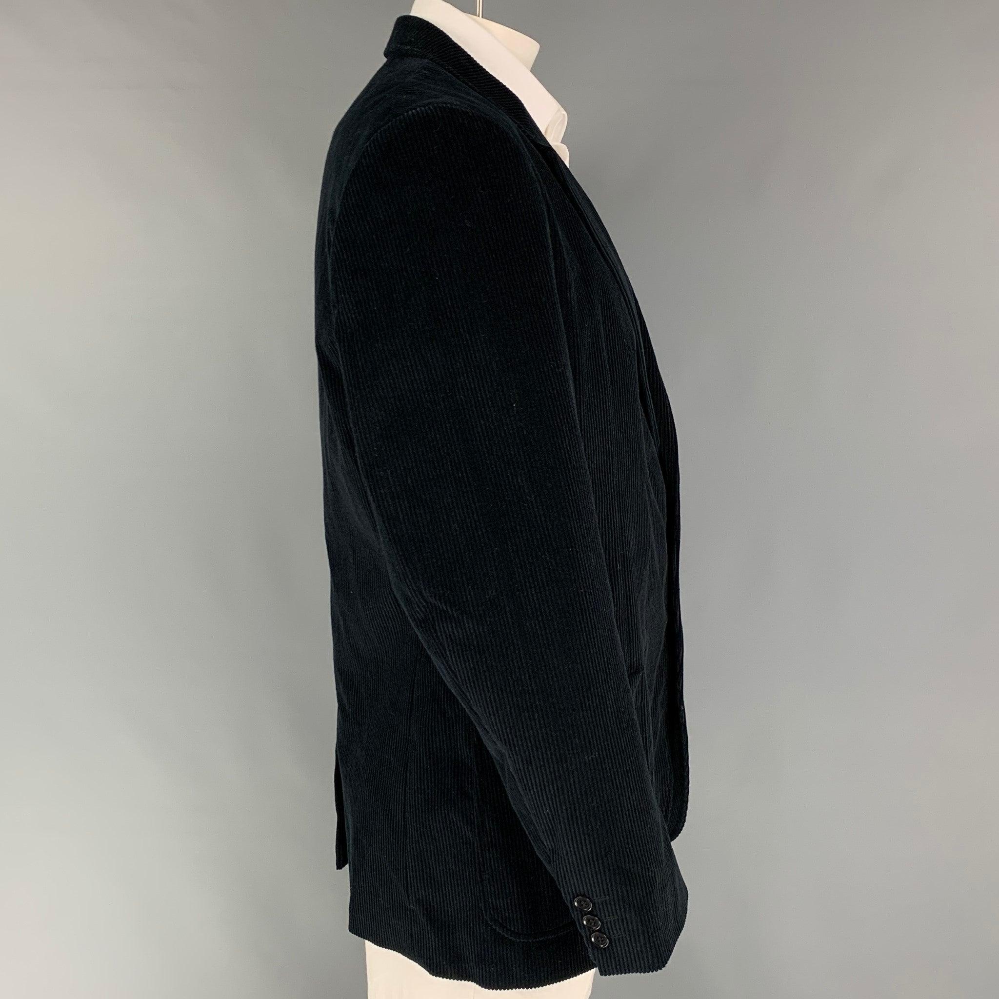 CALVIN KLEIN sport coat comes in a black corduroy cotton with a full liner featuring a notch lapel, patch pockets, single back vent, and a double button closure. Made in Italy.
Very Good
Pre-Owned Condition.  

Marked:   54-42/43 

Measurements: 

