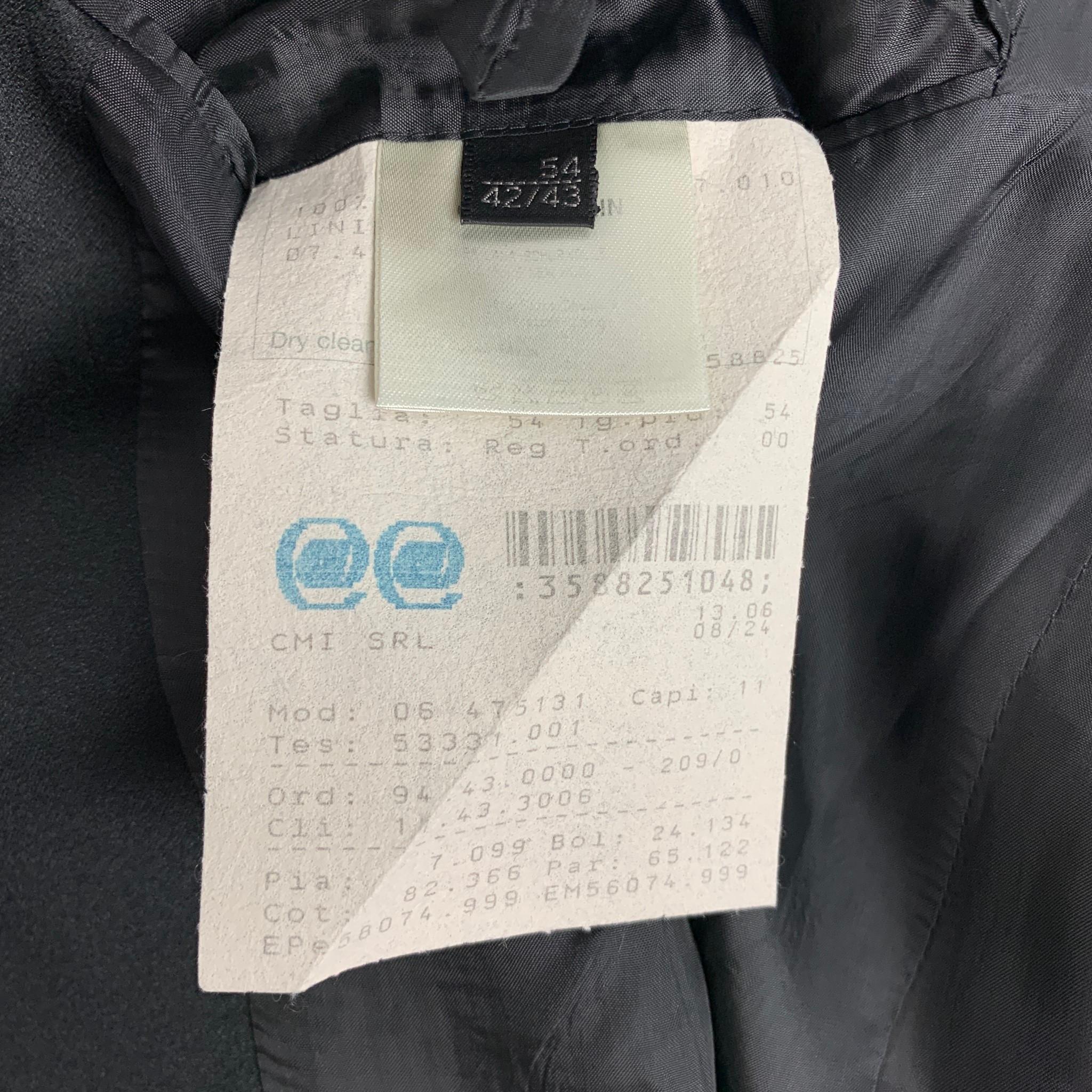 CALVIN KLEIN COLLECTION tuxedo sport coat comes in a black wool with a full liner featuring a notch lapel, flap pockets, and a double button closure.

Very Good Pre-Owned Condition.
Marked: 44/54

Measurements:

Shoulder: 19 in.
Chest: 44