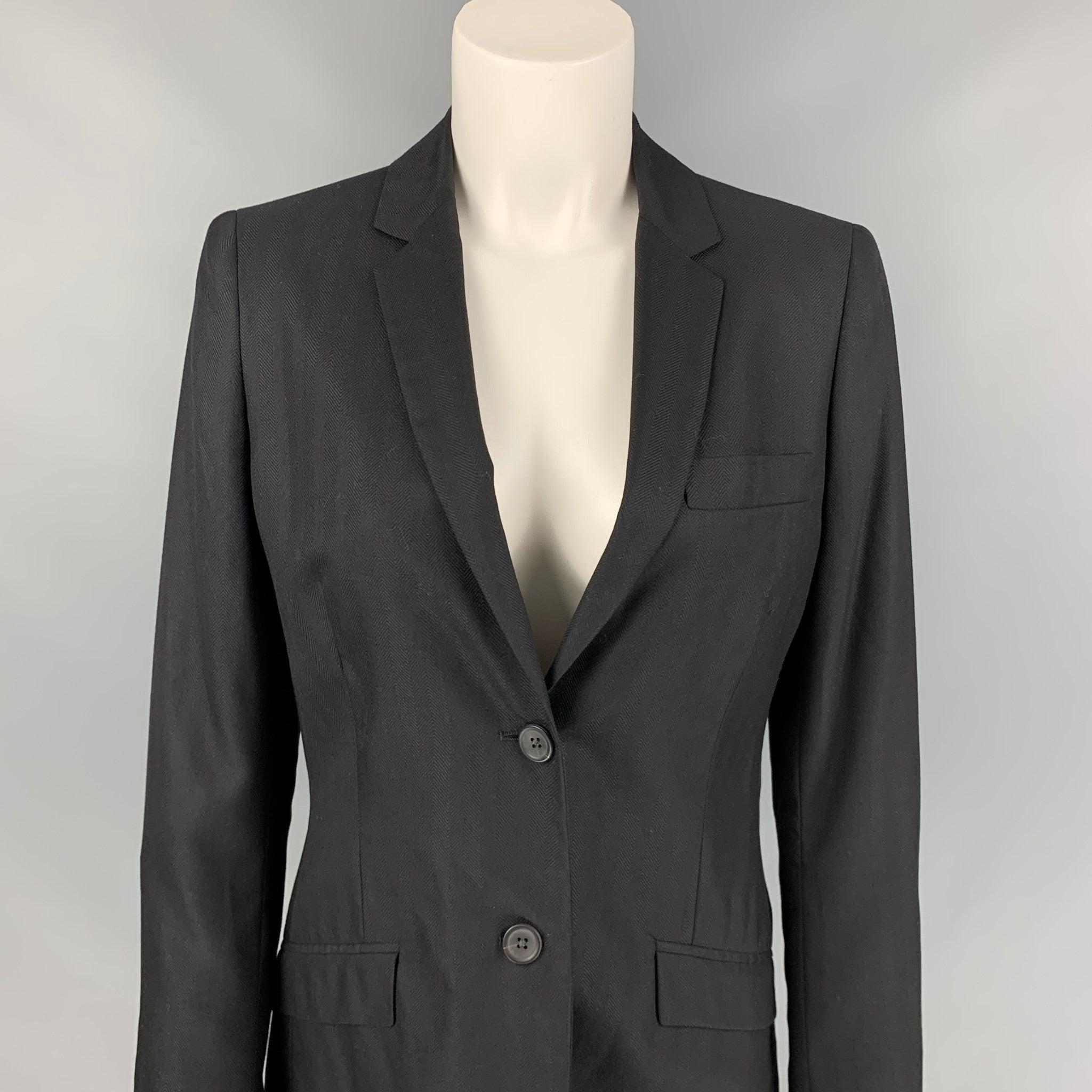CALVIN KLEIN COLLECTION jacket blazer comes in a black cashmere / silk with a full liner featuring a notch lapel, flap pockets, and a double button closure. Made in Italy.
Very Good
Pre-Owned Condition. 

Marked:   6/42 

Measurements: 
 
Shoulder:
