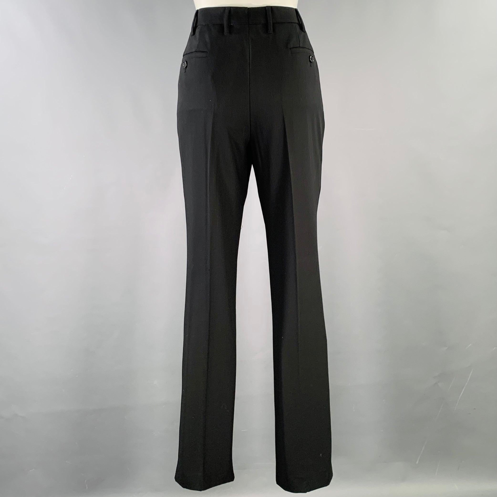 CALVIN KLEIN COLLECTION for BERGDORF GOODMAN dress pants
in a black wool featuring a flat front, wide leg, and zip fly closure. Made in Italy.Very Good Pre-Owned Condition. Minor hole at cuff. 

Marked:   8 

Measurements: 
  Waist: 31 inches Rise: