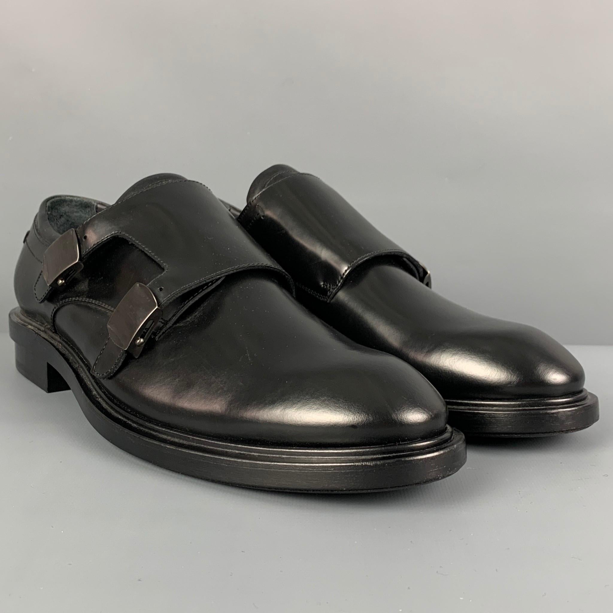 CALVIN KLEIN COLLECTION loafers comes in a black leather featuring a double mon strap and a round toe. Made in Italy.

Very Good Pre-Owned Condition.
Marked: 42

Outsole: 11.75 in. x 4.25 in. 