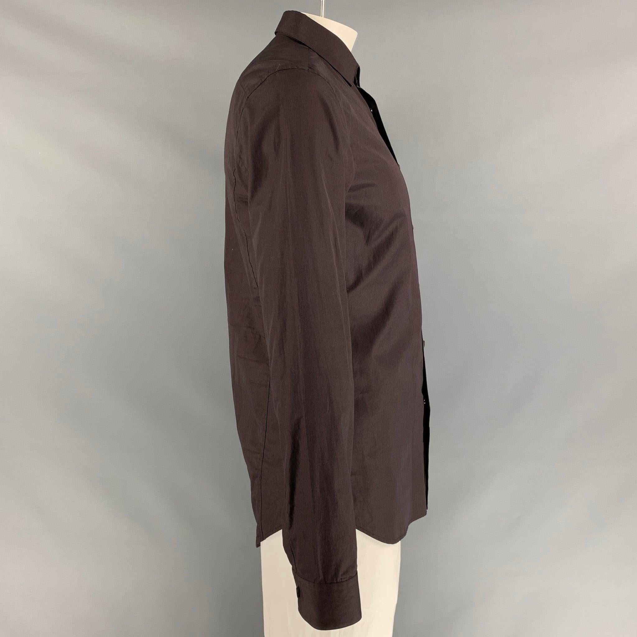 CALVIN KLEIN COLLECTION 
long sleeve shirt comes in solid brown cotton features snap button front, spread collar and one button square cuff. Made in Italy.Excellent Pre-Owned Condition. 

Marked:   L 

Measurements: 
 
Shoulder: 18 inChest: 42