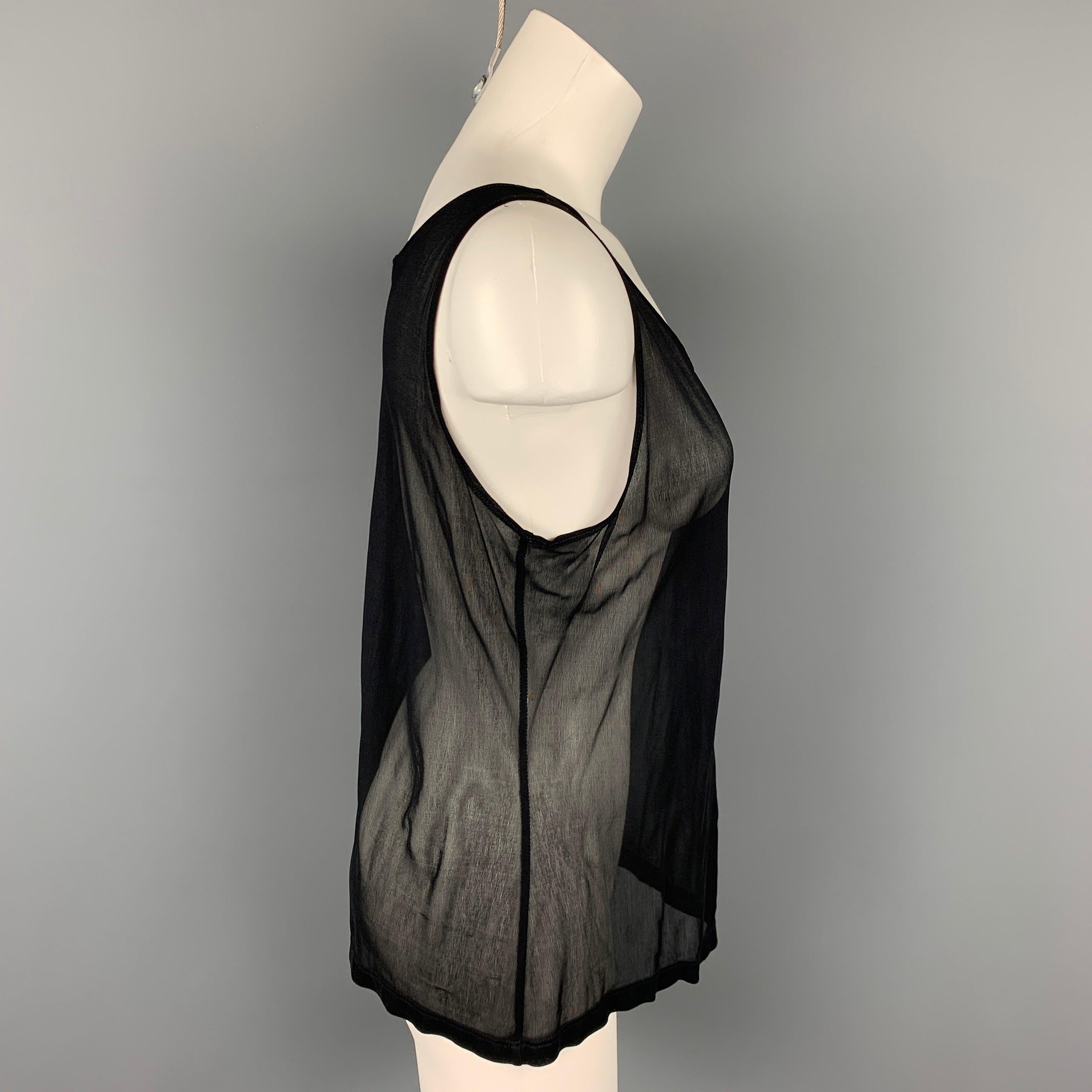 CALVIN KLEIN COLLECTION tank top black mesh viscose featuring a deep neck. Made in USA.Very Good Pre-Owned Condition. 

Marked:   M 

Measurements: 
  Bust: 36 inches  Length: 20.5 inches  
  
  
 
Reference: 107040
Category: T-Shirt - Womens
More