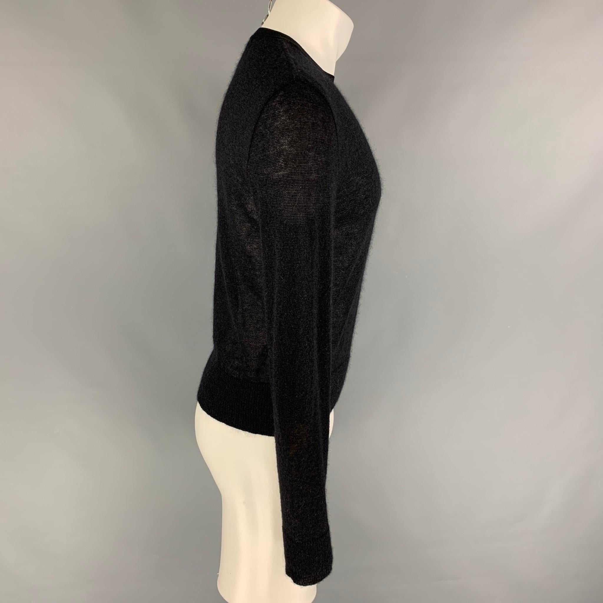 CALVIN KLEIN COLLECTION pullover comes in a black mohair blend featuring a crew-neck. Made in Italy. 

Very Good Pre-Owned Condition.
Marked: S

Measurements:

Shoulder: 17.5 in.
Chest: 38 in.
Sleeve: 29 in.
Length: 23 in. 