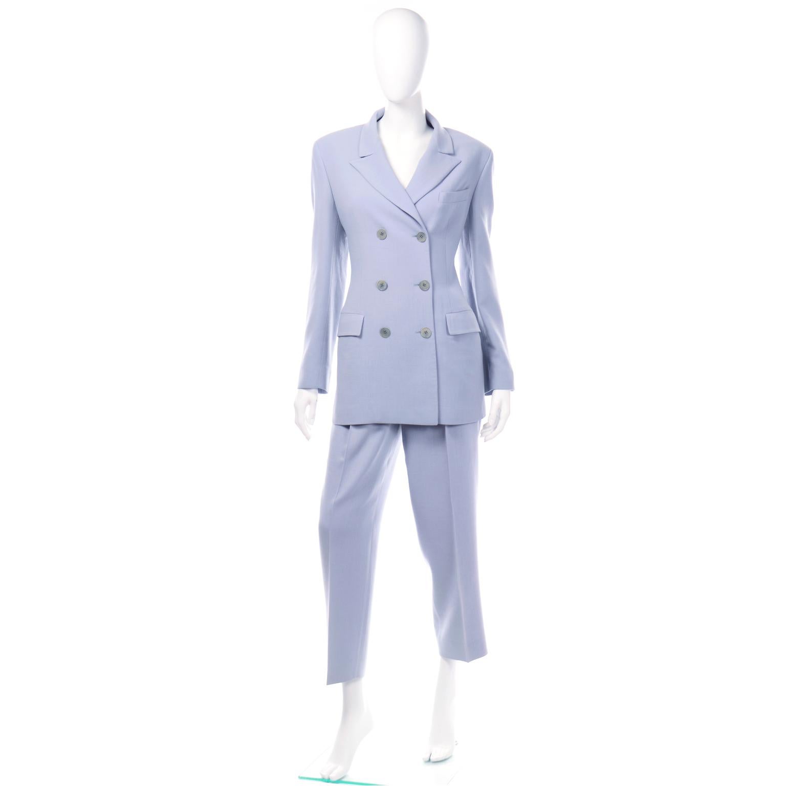 This monochromatic Calvin Klein Collection pant suit is in a beautiful periwinkle blue summer weight wool. This suit is so modern and can be worn as a suit or it can be broken up to give you two great separates to wear with other pieces. The double