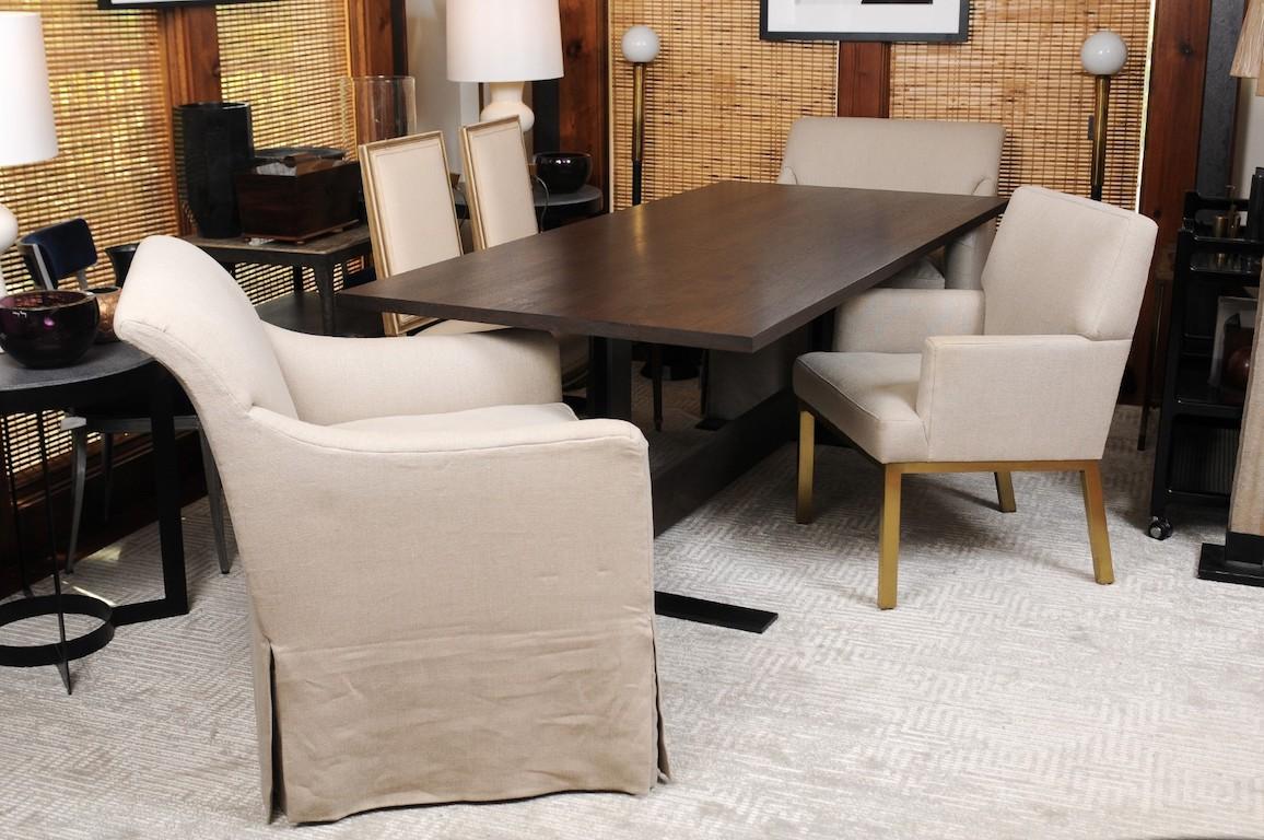 Clean Classic lines make this Curator collection dining table by Calvin Klein equally comfortable as a dining table or a desk, and both in traditional and modern interiors. The large wood top rests comfortably above the wide base at either end, yet