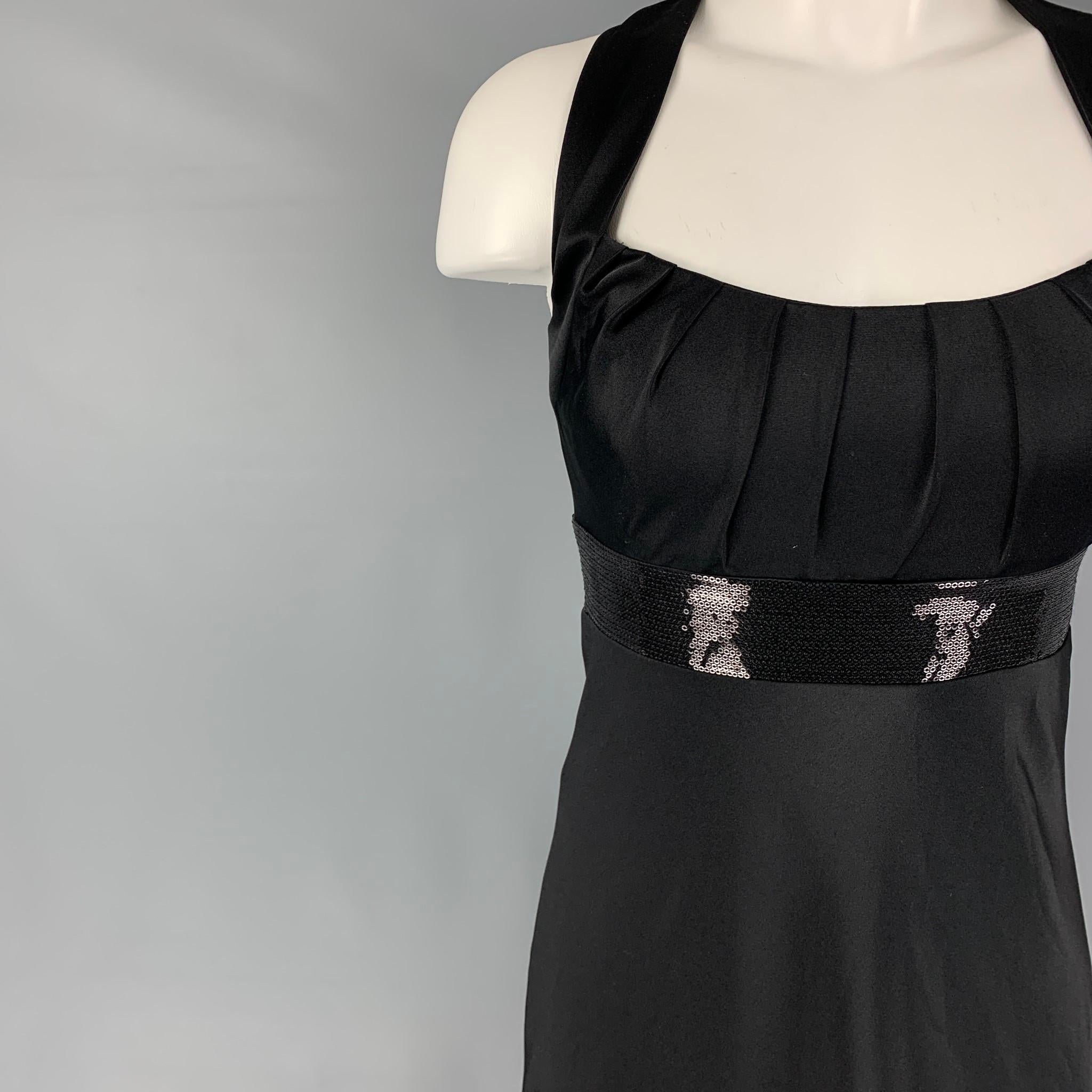 CALVIN KLEIN dress comes in a black polyester with a slip liner featuring a sequined panel detail, criss cross back, sleeveless, and a back zipper closure. 

New with tags. 
Marked: 2

Measurements:

Bust: 30 in.
Waist: 26 in.
Hip: 34 in.
Length: 53