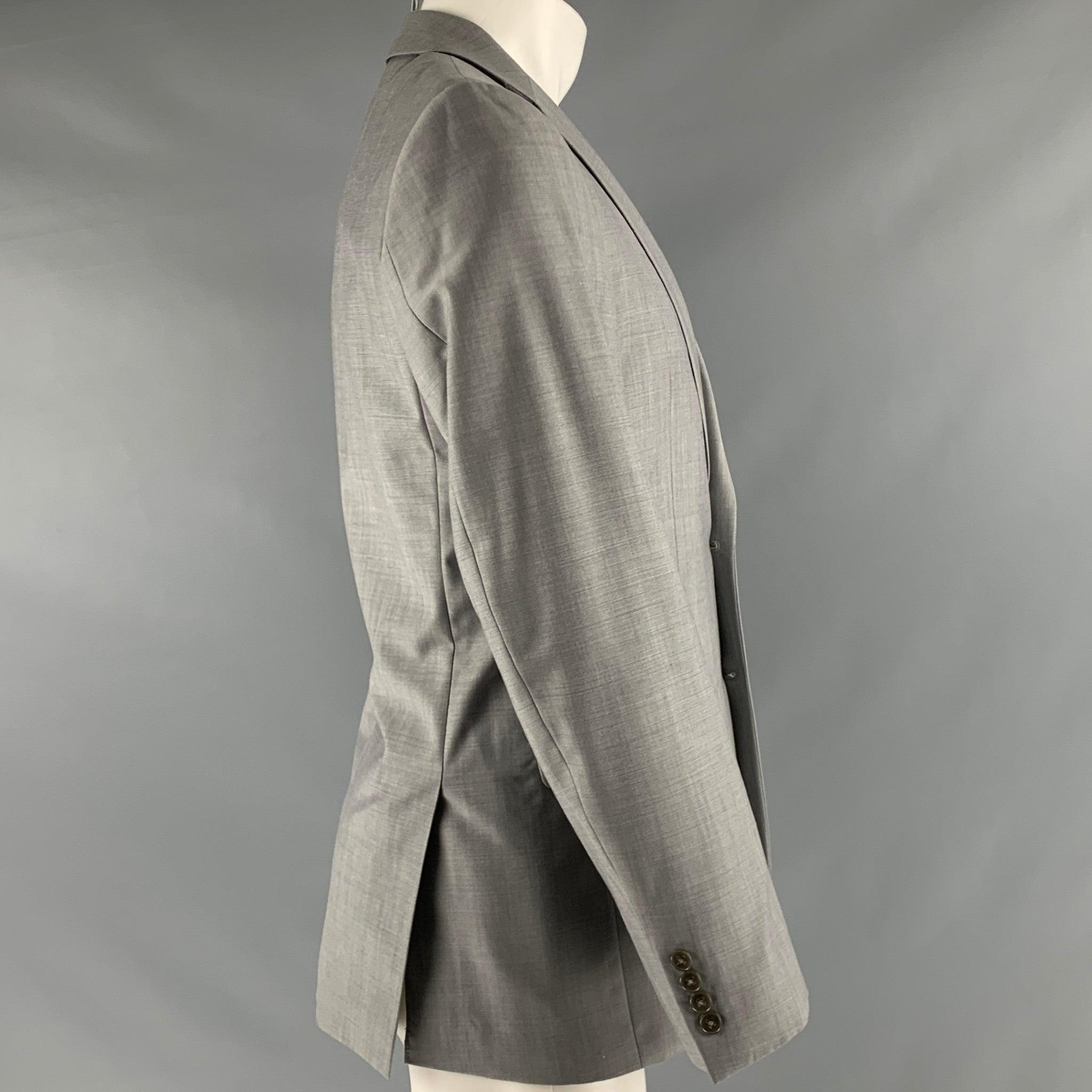 CALVIN KLEIN sport coat in a grey wool with a grey liner and includes a single breasted, two button sport coat with a notch lapel.Very Good Pre-Owned Condition. Minor marks. 

Marked:   48 

Measurements: 
 
Shoulder: 17 inches  Chest: 38 inches 