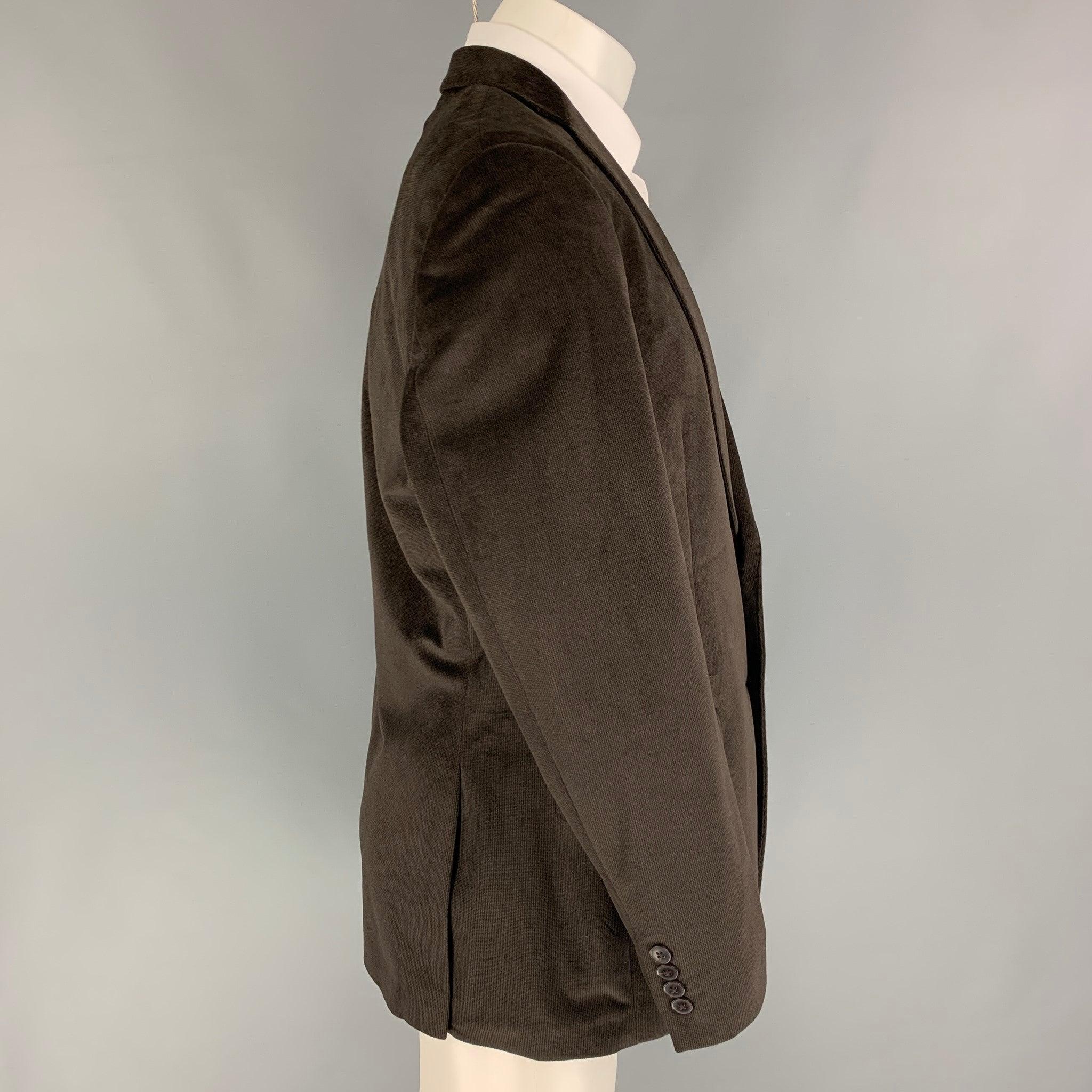 CALVIN KLEIN sport coat comes in a black polyester velvet with a full liner featuring a notch lapel, flap pockets, double back vent, and a double button closure.
Very Good
Pre-Owned Condition. 

Marked:   40 R  

Measurements: 
 
Shoulder: 19 inches
