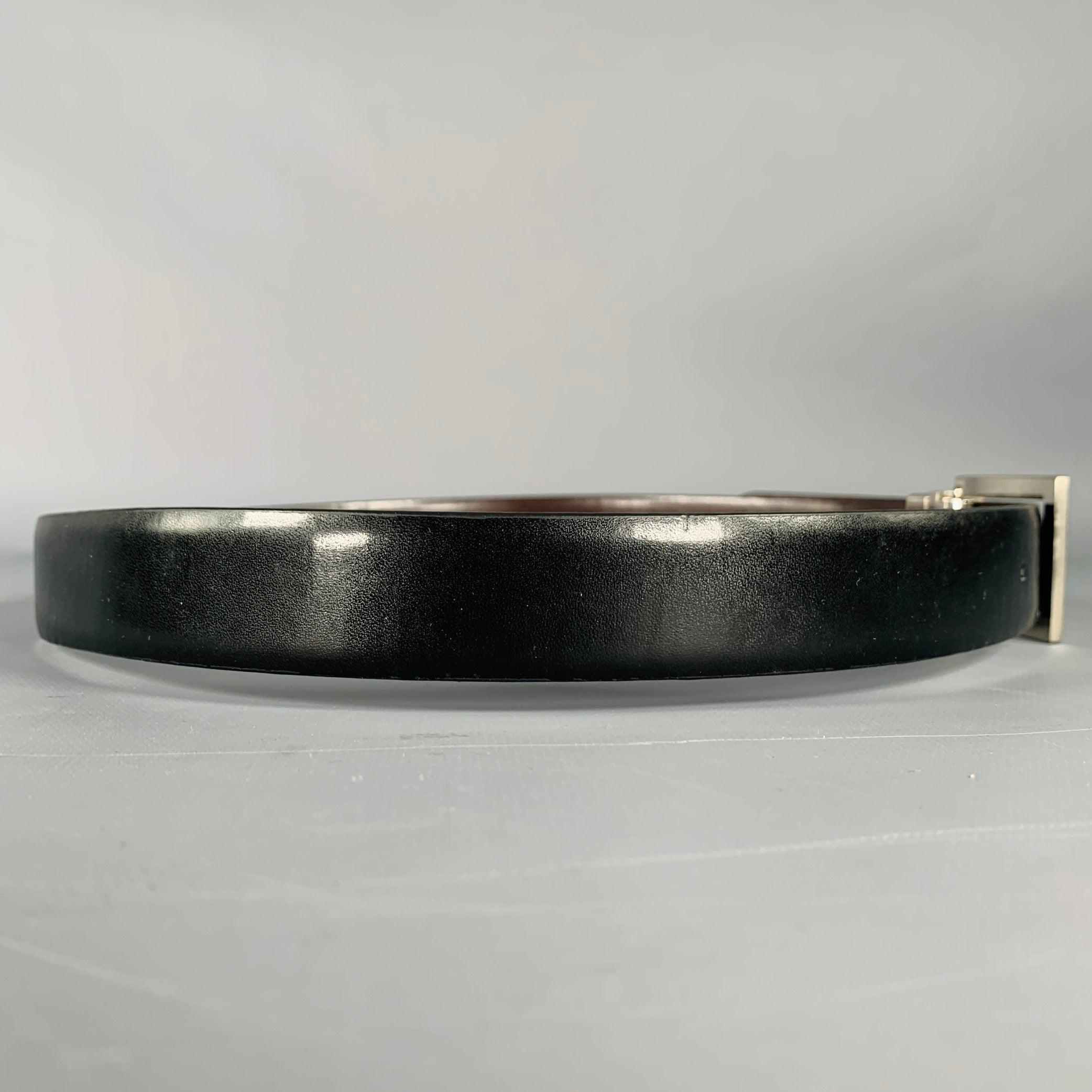 CALVIN KLEIN
belt in a black leather fabric featuring silver tone hardware.Very Good Pre-Owned Condition. Minor signs of wear on back of belt. 

Marked:   SLength: 35.5 inches Width: 1 inches Fits: 28 inches  - 32 inches Buckle: 1.5 inches 
  
  
