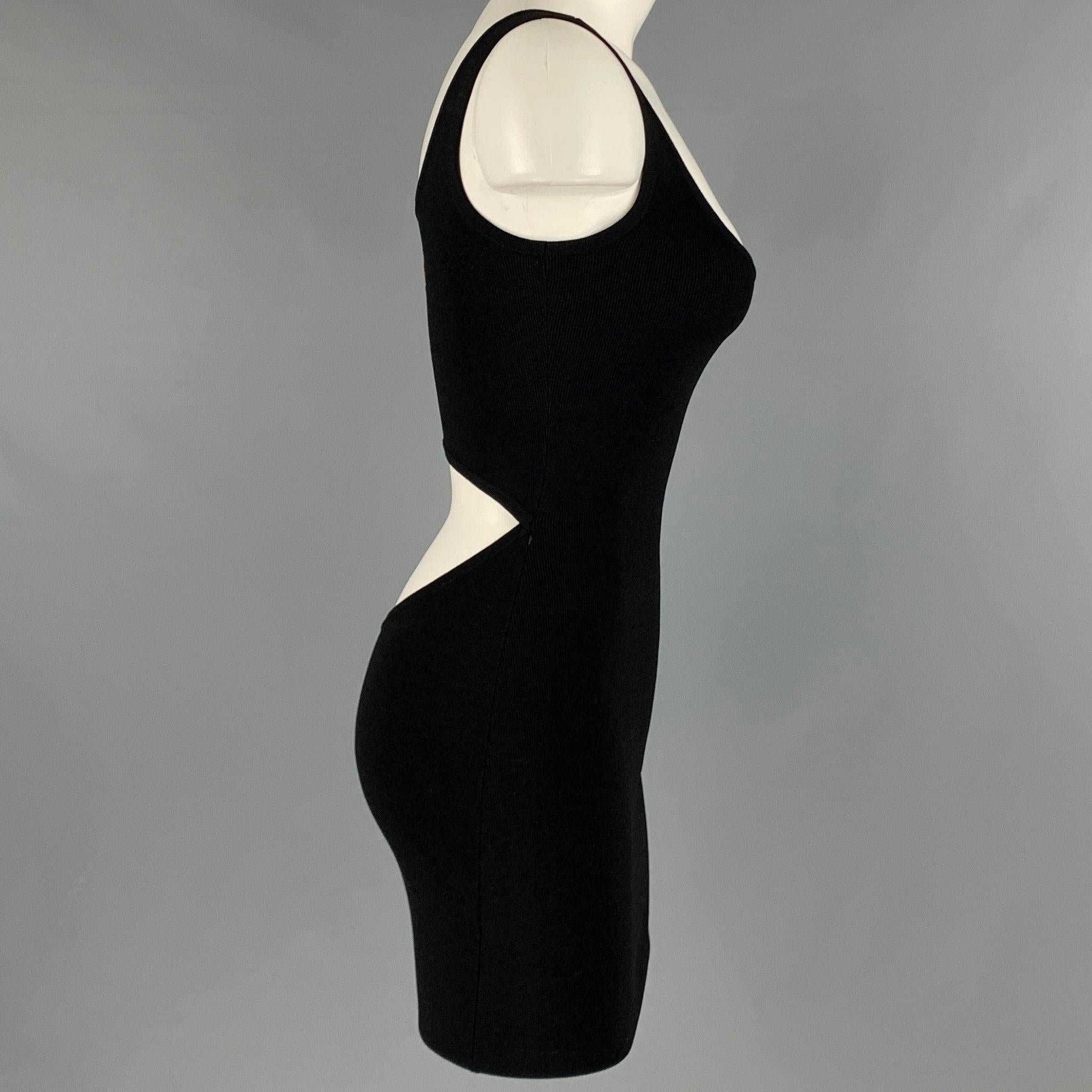 CALVIN KLEIN dress
in a black jersey material featuring a stretchy bodycon style, open back, and above knee length.Very Good Pre-Owned Condition. Minor hole on right side. Care and size tags have been removed. 

Marked:   size not marked.