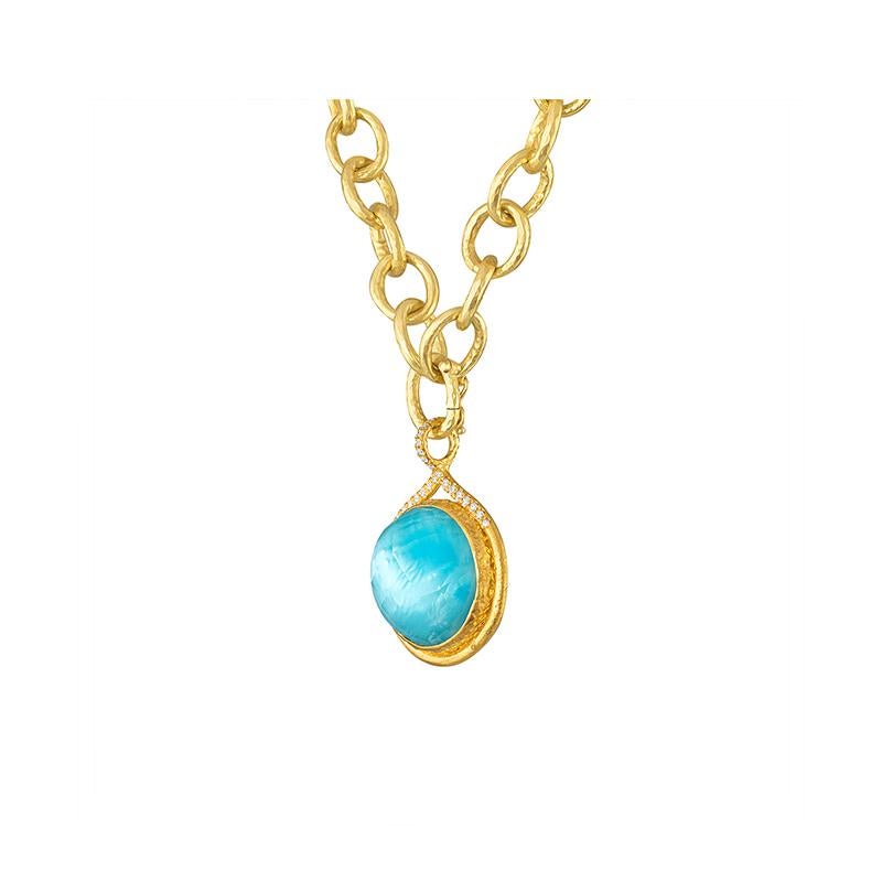 The Calypso Diamond Pendant is set in 22k gold and features 22 diamonds around the top and the bail. The center stone features a spectacular doublet with Turquoise and Crystal laid atop. The beauty of the Crystal is it gives the stone an iridescent