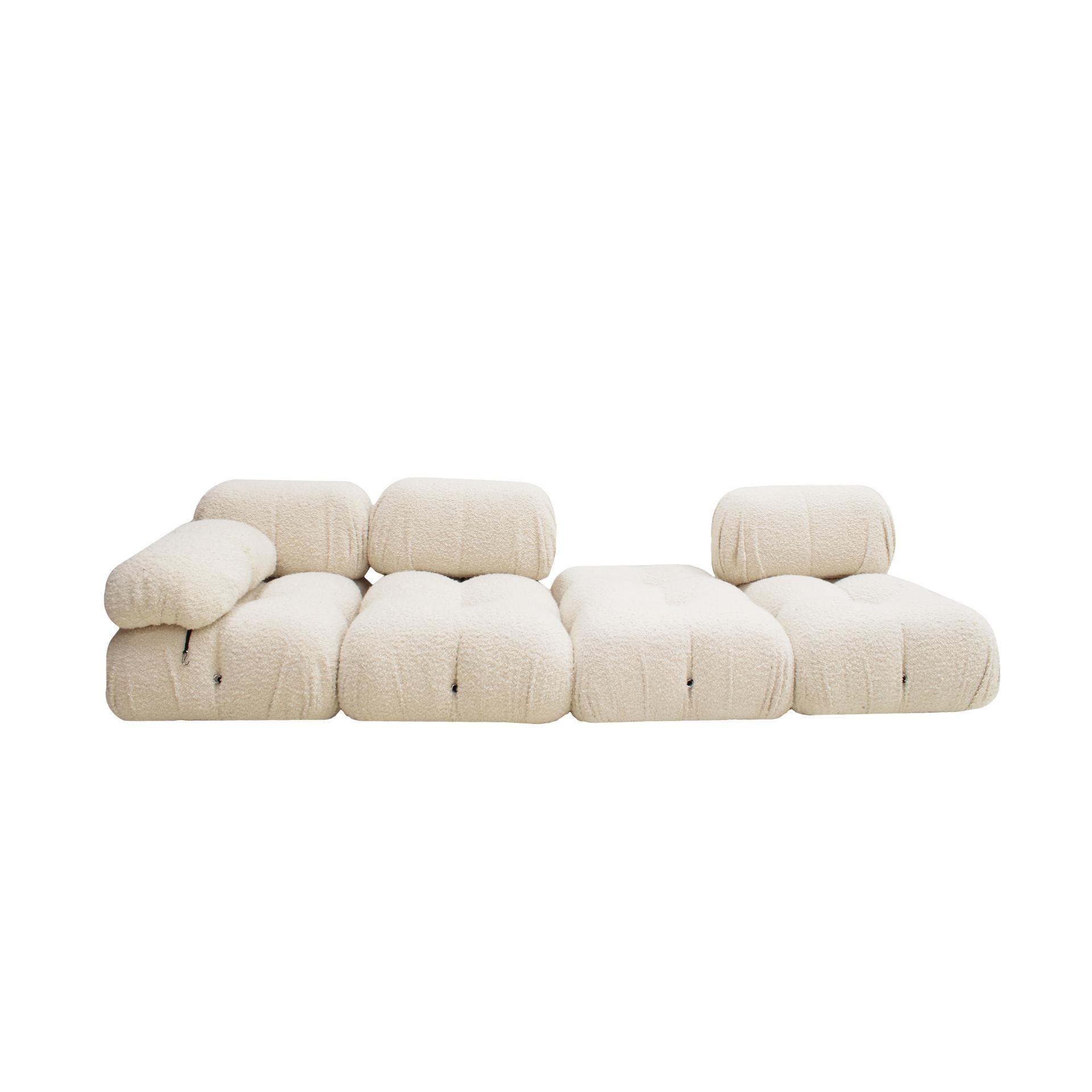 Camaleonda modular sofa designed by Mario Bellini (1935) for C&B Italia in 1972. Composed of 4 large modular seats with backrest, 3 small modular seats with backrest, 1 small module without backrest and 1 shoe remover chair. White bouclé wool