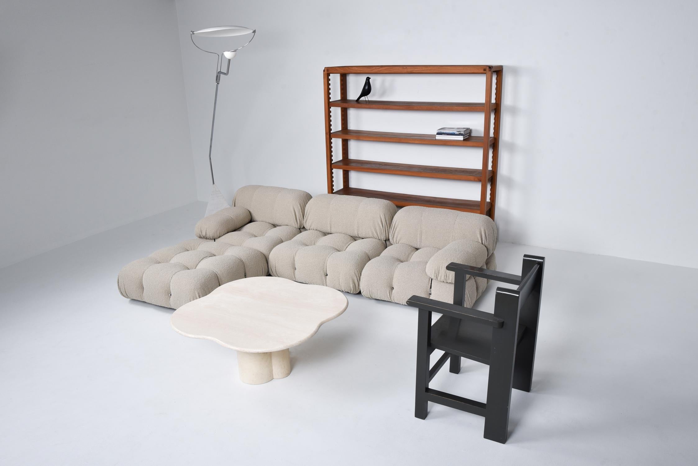 Postmodern modular couch by Mario Bellini in Grey for B&B Italia in the 1970s. The entire sofa consists of 4 big seating elements, 3 backrests and 2 armrests. The couch has been reupholstered in a grey Bouclé wool. We can assemble your dream sofa