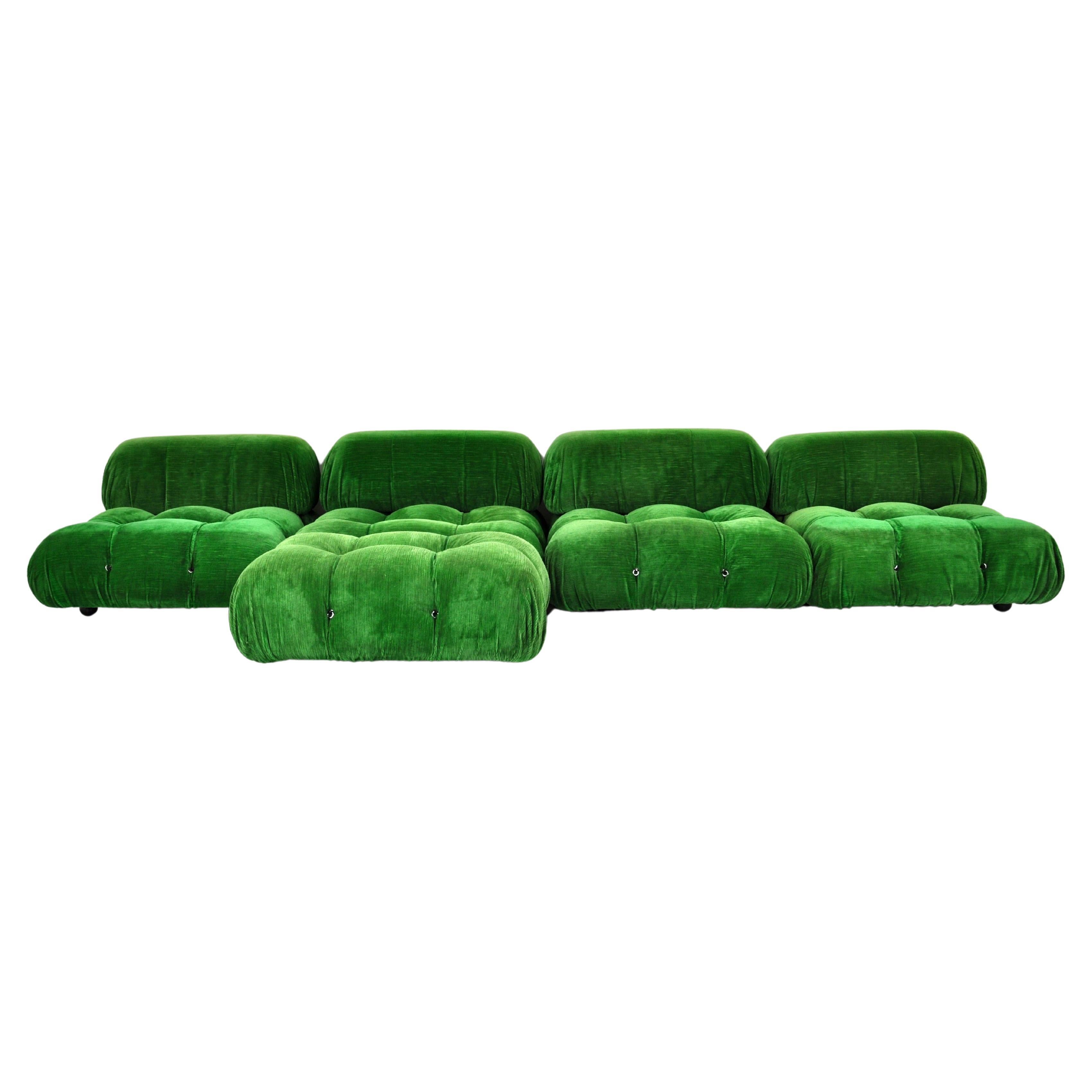 Green velvet sofa. There are 4 large pieces and an ottoman. Seat height: 35 cm. Dimensions of one piece: H: 67 W: 94 cm D: 94 cm
Ottoman dimensions: H: 35 cm W: 94 cm D: 65cm.
Wear due to time and age of the sofa.
Stamped B&B Italia.