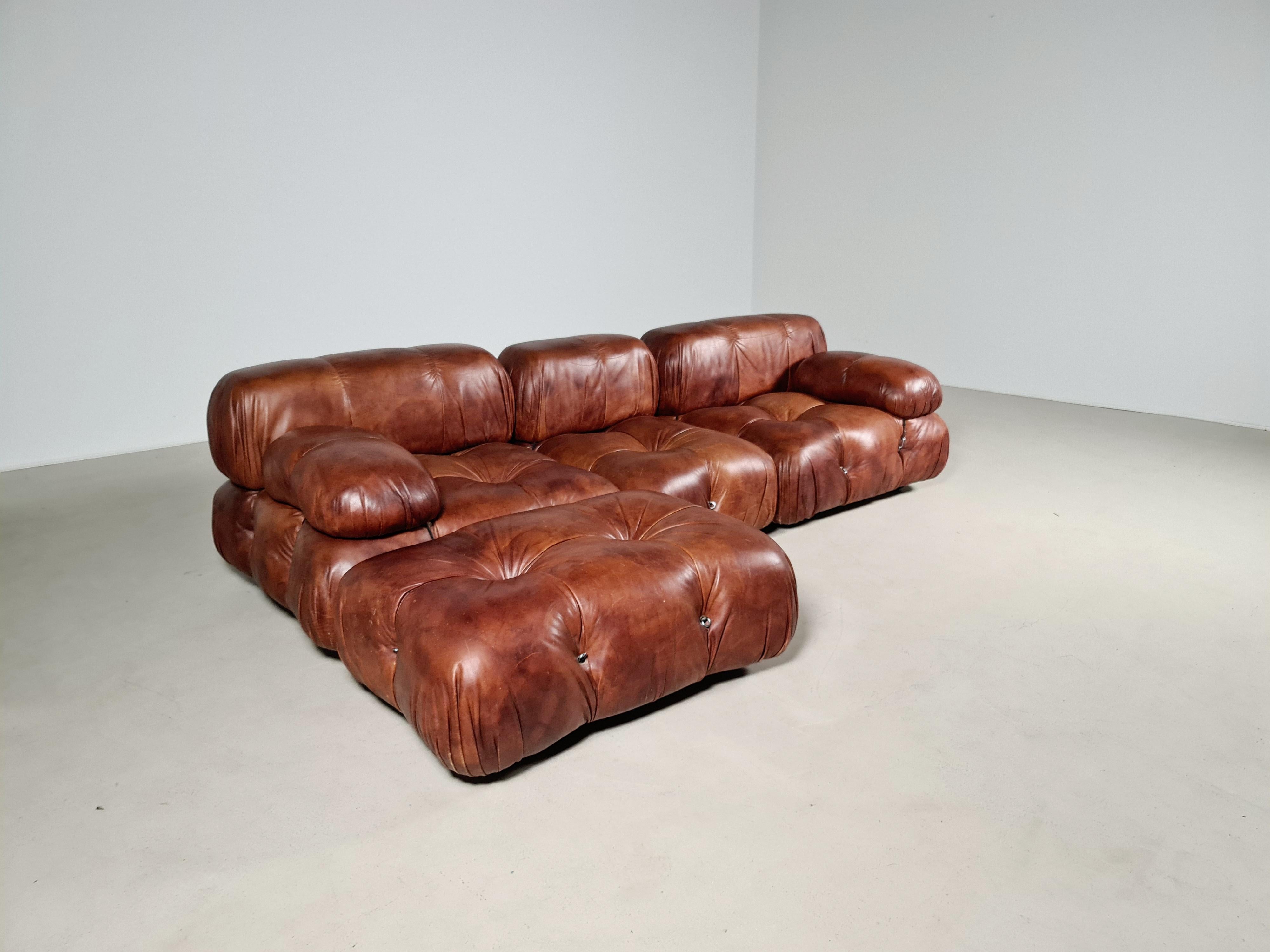 The sectional elements of this sofa can be used freely and apart from one another. Because the sofa is modular and backs and armrests are provided with rings and carabiners, you can create many different settings. 
The leather aged perfectly over