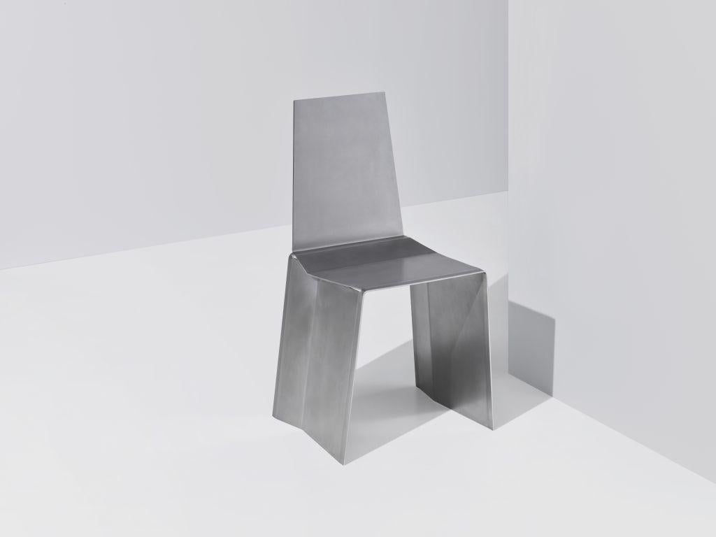 Camber Chair, Paul Coenen
Dimensions: L 40.5 x W 42.0 x H 84.5 cm
Materials: Stainless Steel
Custom materials, sizes and finishes possible on request. Please contact us.

The Camber Chair originated from the idea of manufacturing a piece of