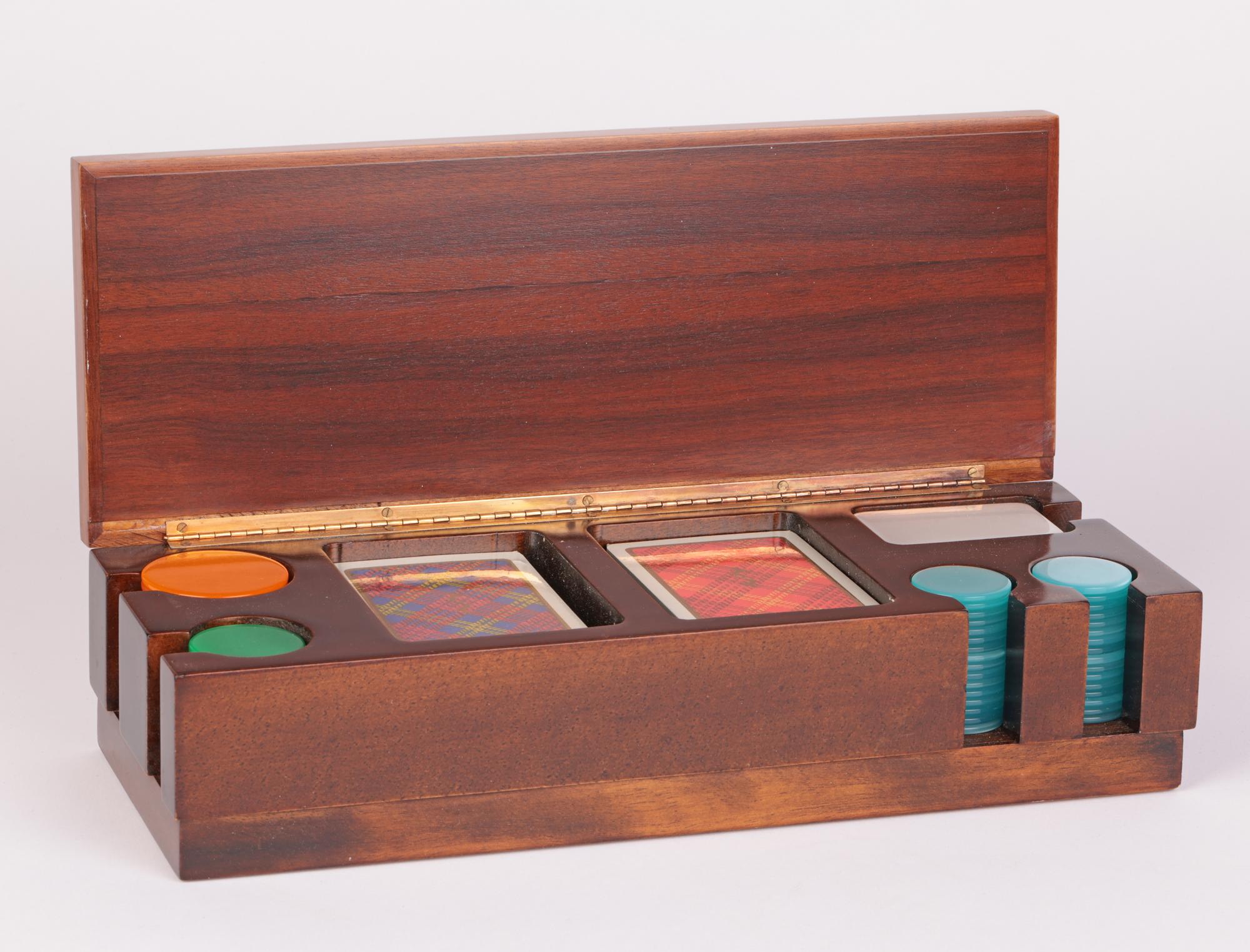 An exceptional quality mid-century Italian wooden games box attributed to Cambissa & Co. The box is constructed from two different colored woods assembled in three sections. The body of the box made in a slightly darker wood comprises of five