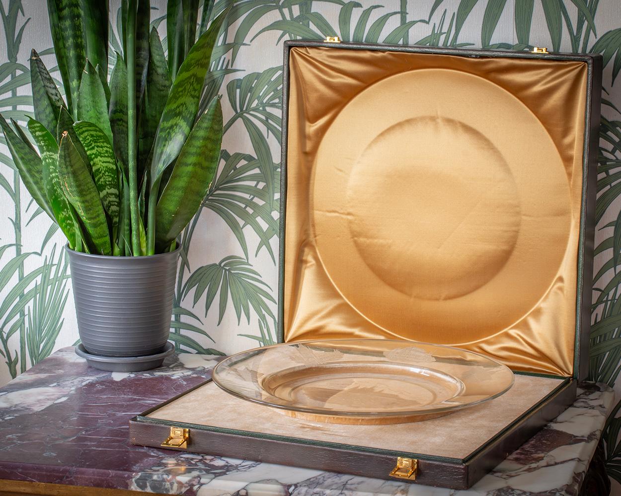 From our Glassware collection, we are pleased to offer this Cambodia Presentation Glass Charger in its original Hermes of Paris case.

The charger is finely engraved with eight famous landmarks across Czechoslovakia, including a detailed central