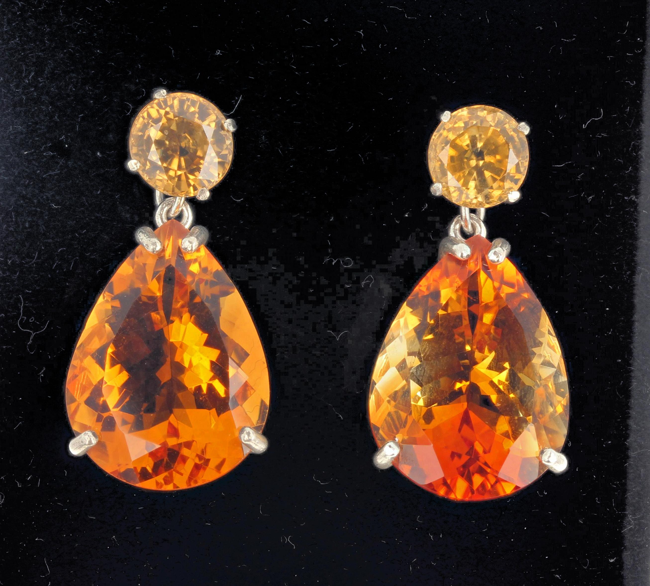Brilliant yellow 7mm natural round Cambodian Zircons (2.5 carats each) elegantly dangle glittering gemcut pear shaped multicolor natural Citrines (20 carats each - 20 mm x 15 mm) on these sterling silver stud earrings.  There are no black marks in