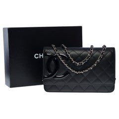Portemonnaie von Chanel mit Kette (WOC)  Umhängetasche aus schwarzem gestepptem Leder, SHW