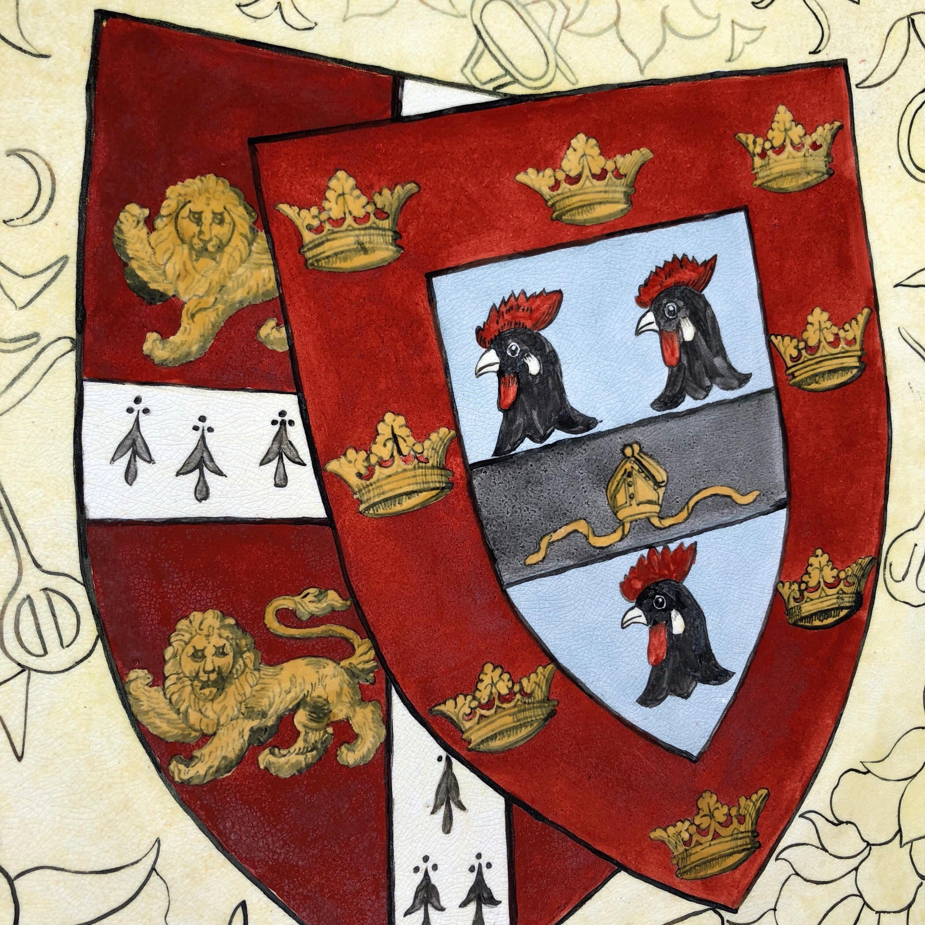 Large heraldic pottery dish, well painted with the arms of Jesus College, Cambridge, on a ground painted with classical motifs,
circa 1880.