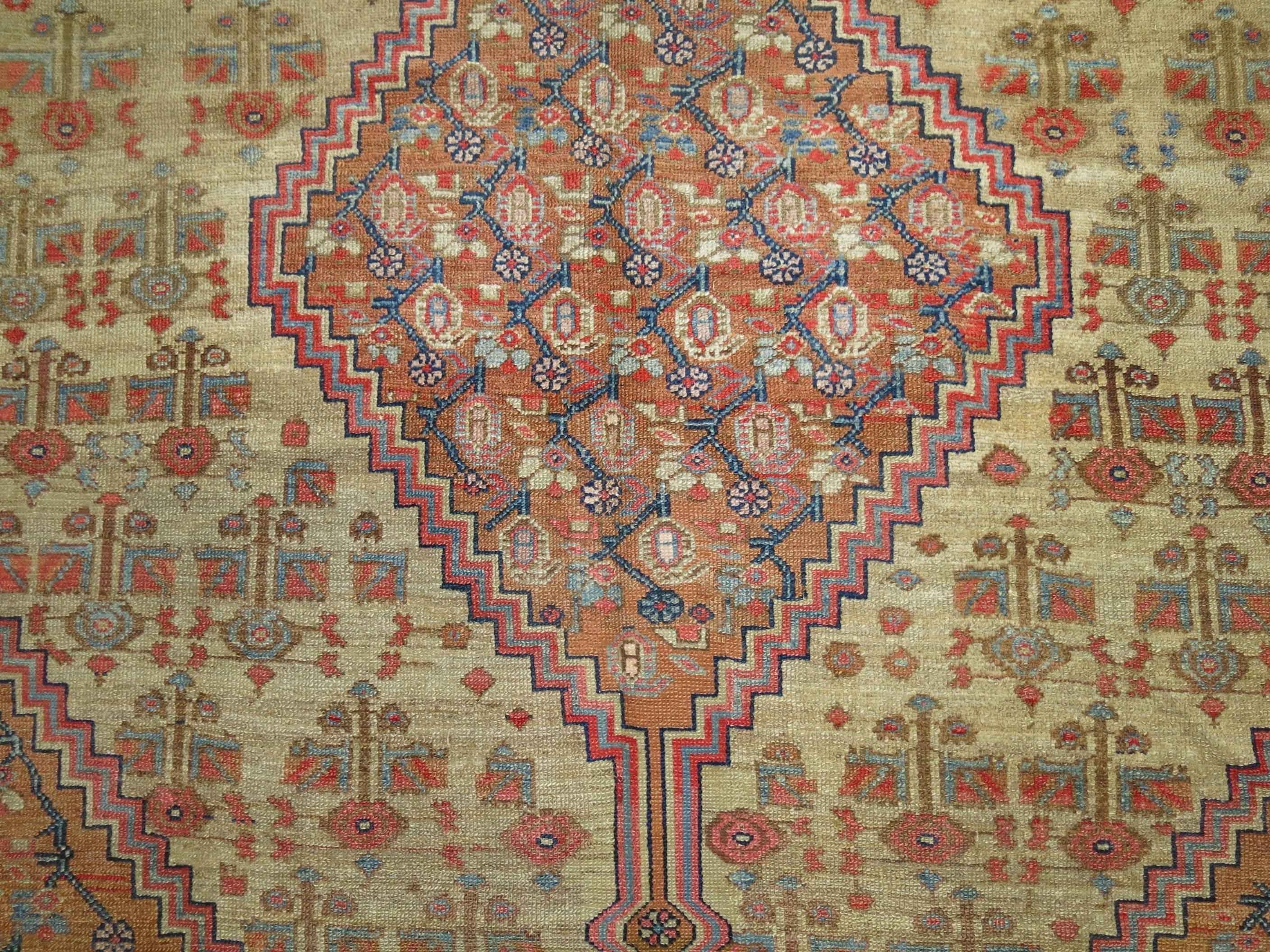 Rare room size Camel Field Persian Serab rug with characteristics stemming from 19th century Persian Bakshaish rugs. The harmonious colors, skillful geometry and weavers craftsmanship make this rug an absolute work of art.

The best antique rugs