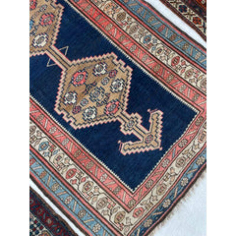 Incredible Kurdish Runner with Piercing navy, pinks, Salmon and Camel Hair Antique Runner

About: If looks could kill, this piece is dangerous! So, so good! Mystical, gorgeous, high-quality, and just an all-around 10!

Size: 3.8 x 8.4 
Age: