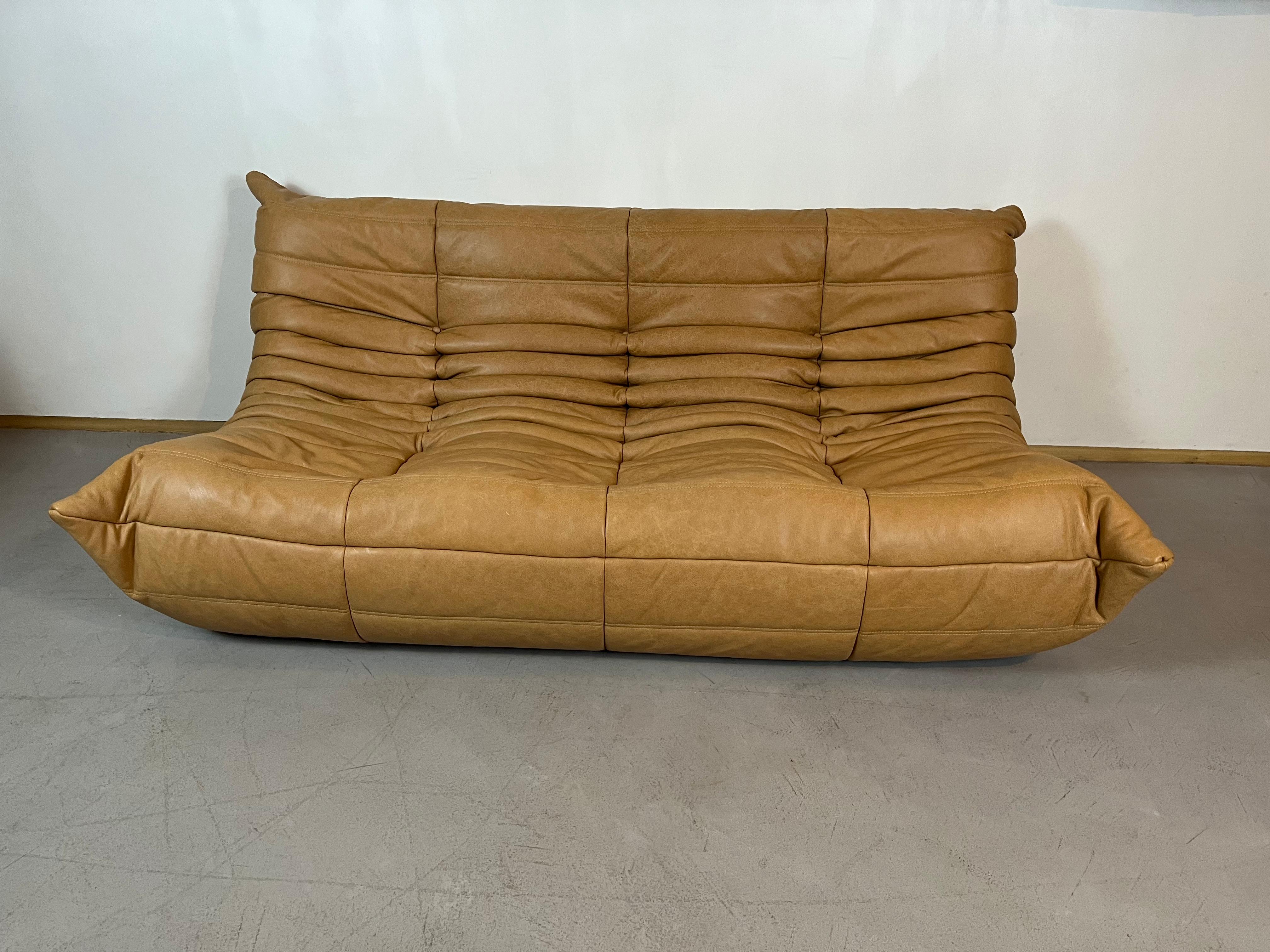 Togo sofa by Michel Ducaroy for Ligne Roset. 5 pieces set
Togo was designed in 1973.
Five pieces set: three seater, twoseater, one seater, corner and pouf.
The sofa is upholstered in camel leather.
the set is very versatile, hte pieces can be