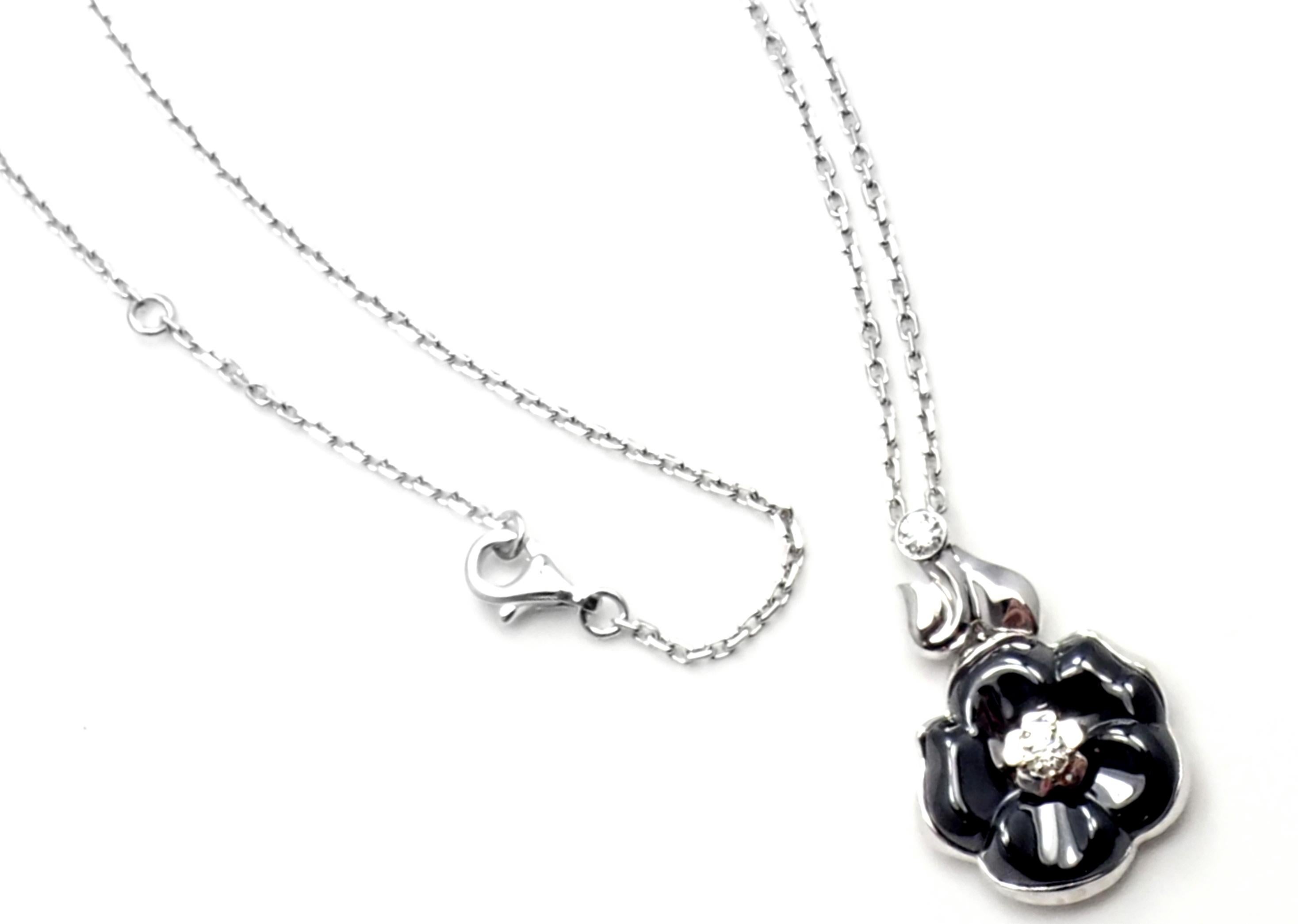 18k White Gold Diamond Black Ceramic Camelia Camellia Flower Pendant Necklace by Chanel. 
With 2 round brilliant cut diamond VVS1 clarity, E color total weight approx..20ct
Details: 
Length: 18